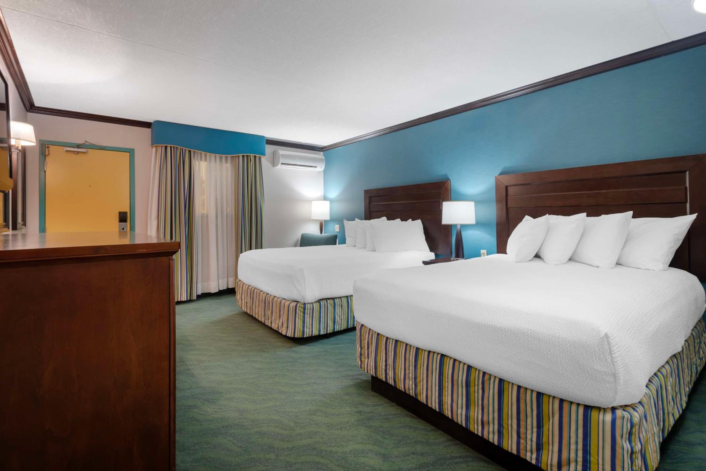 Queen Room with Two Queen Beds - Pool View - Photo 1