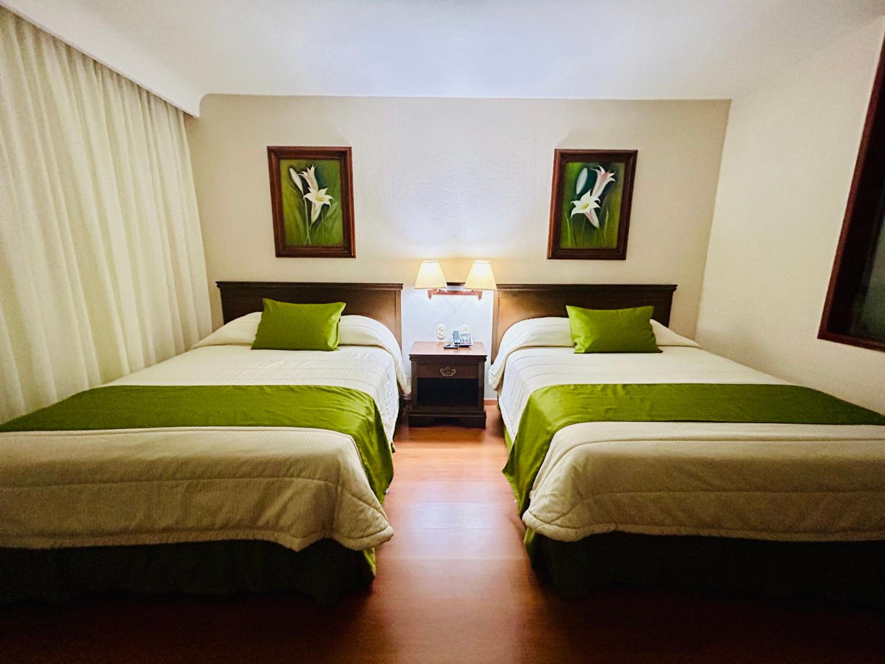 Queen Room with Two Queen Beds - Photo 1