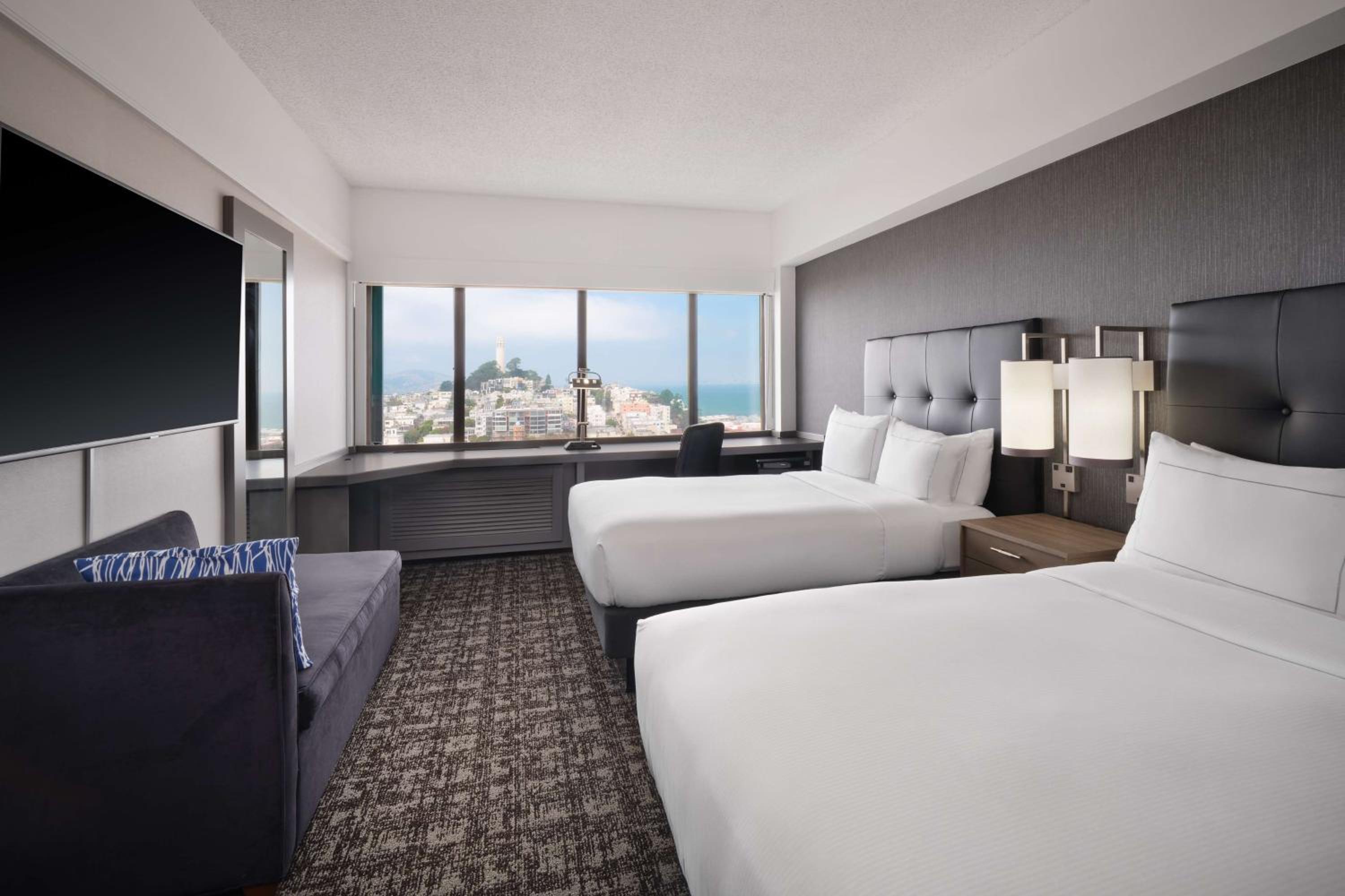 Deluxe Room with Two Double Beds and Bay View - Photo 1