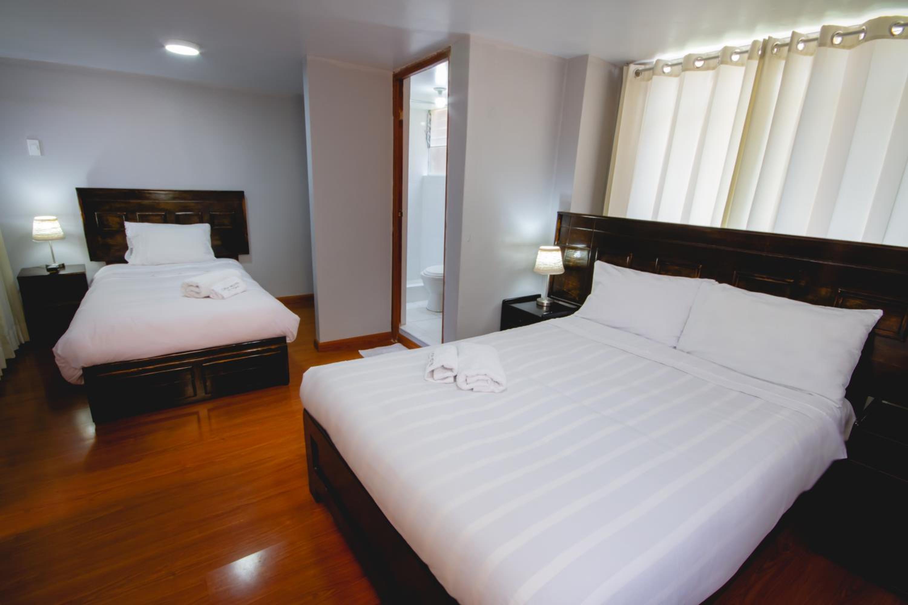 Deluxe Room (2 Adults + 1 Child) - Photo 1