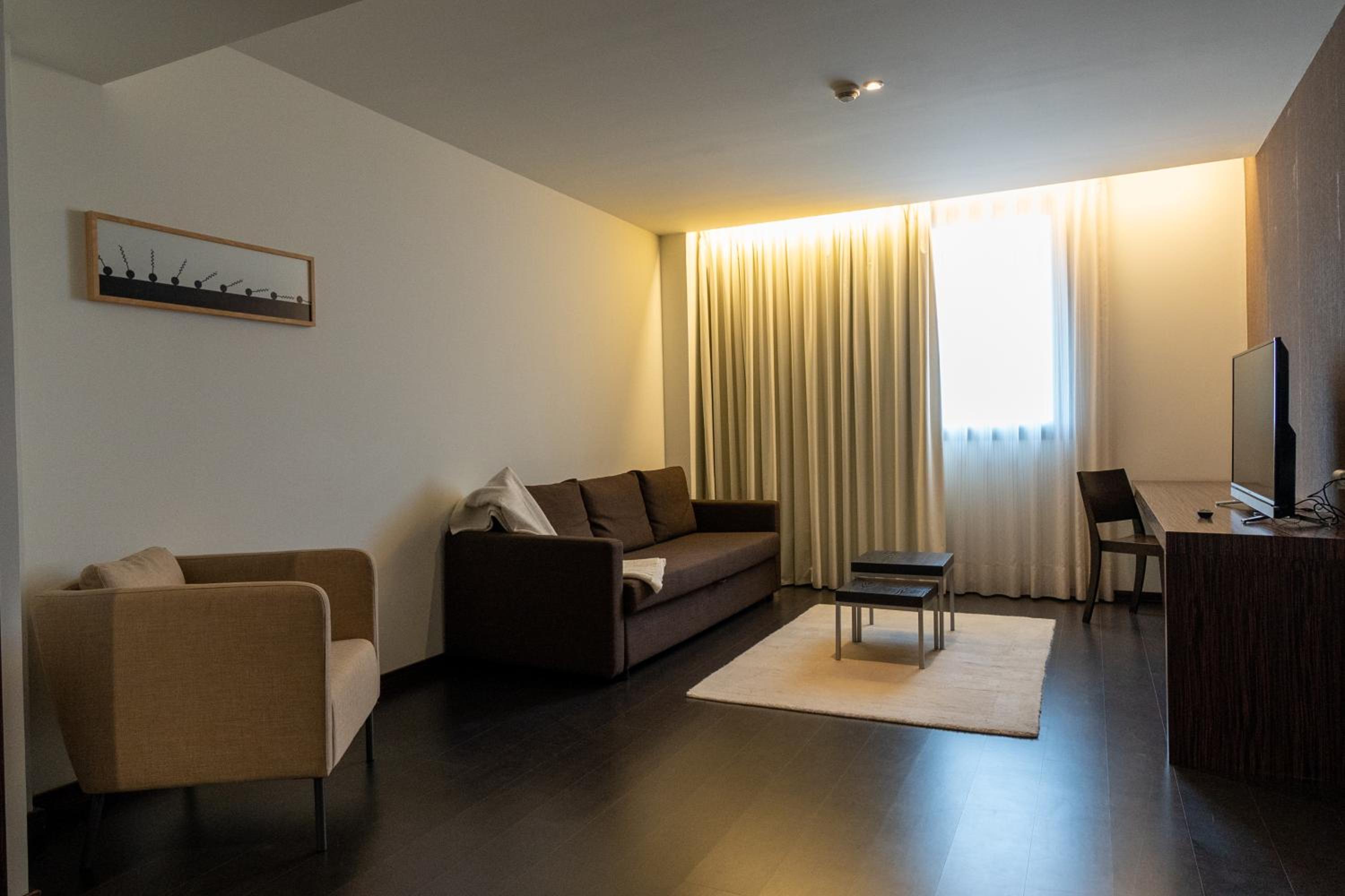Junior Suite 1 King Bed 1 Sofa Bed - Photo 1