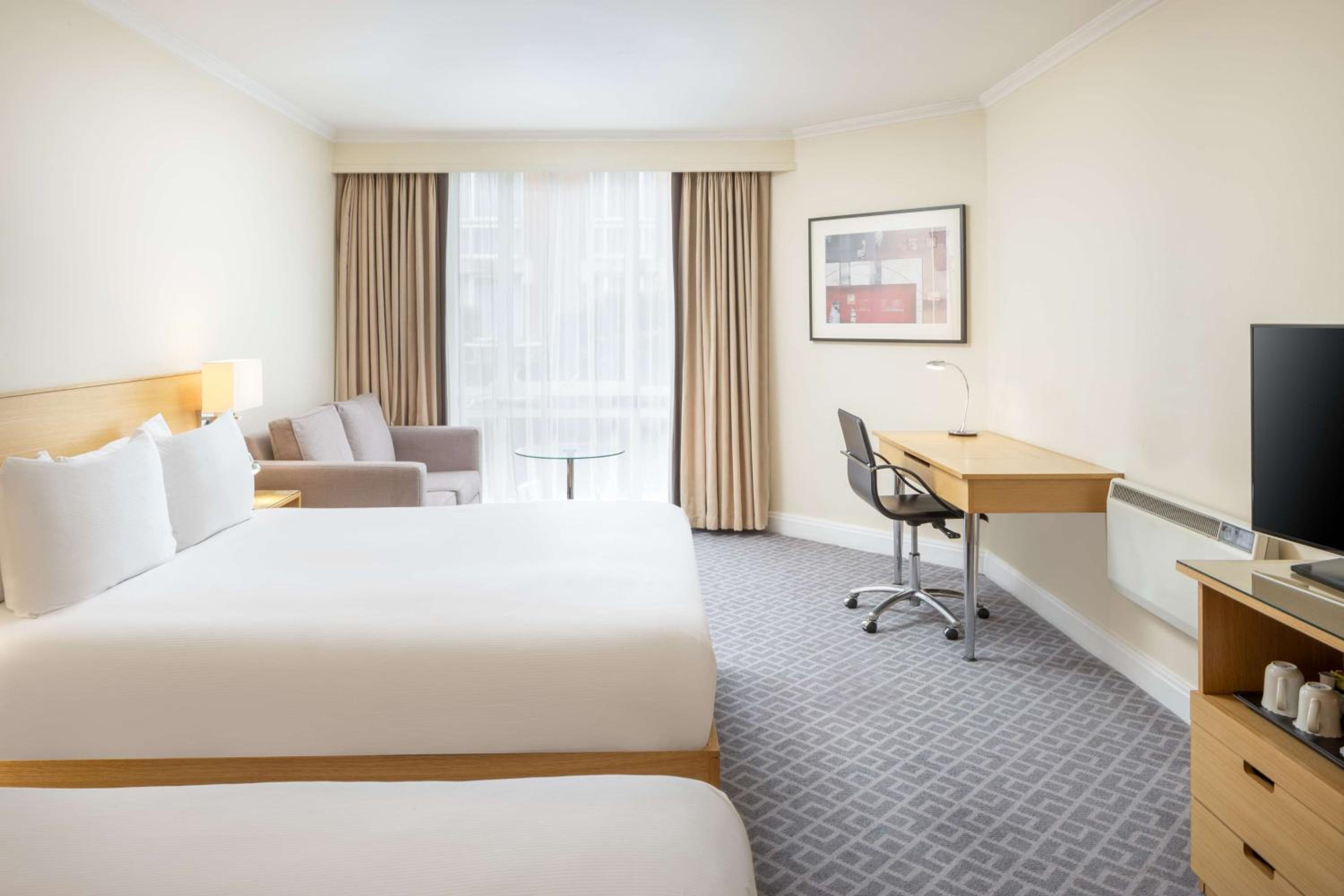 Deluxe Queen Room with Two Queen Beds - Photo 1