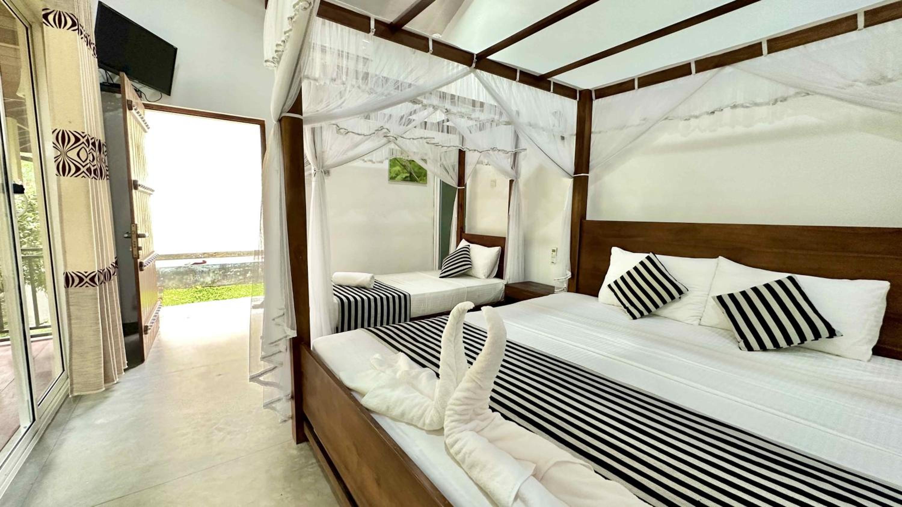 Deluxe Triple Room - Photo 1