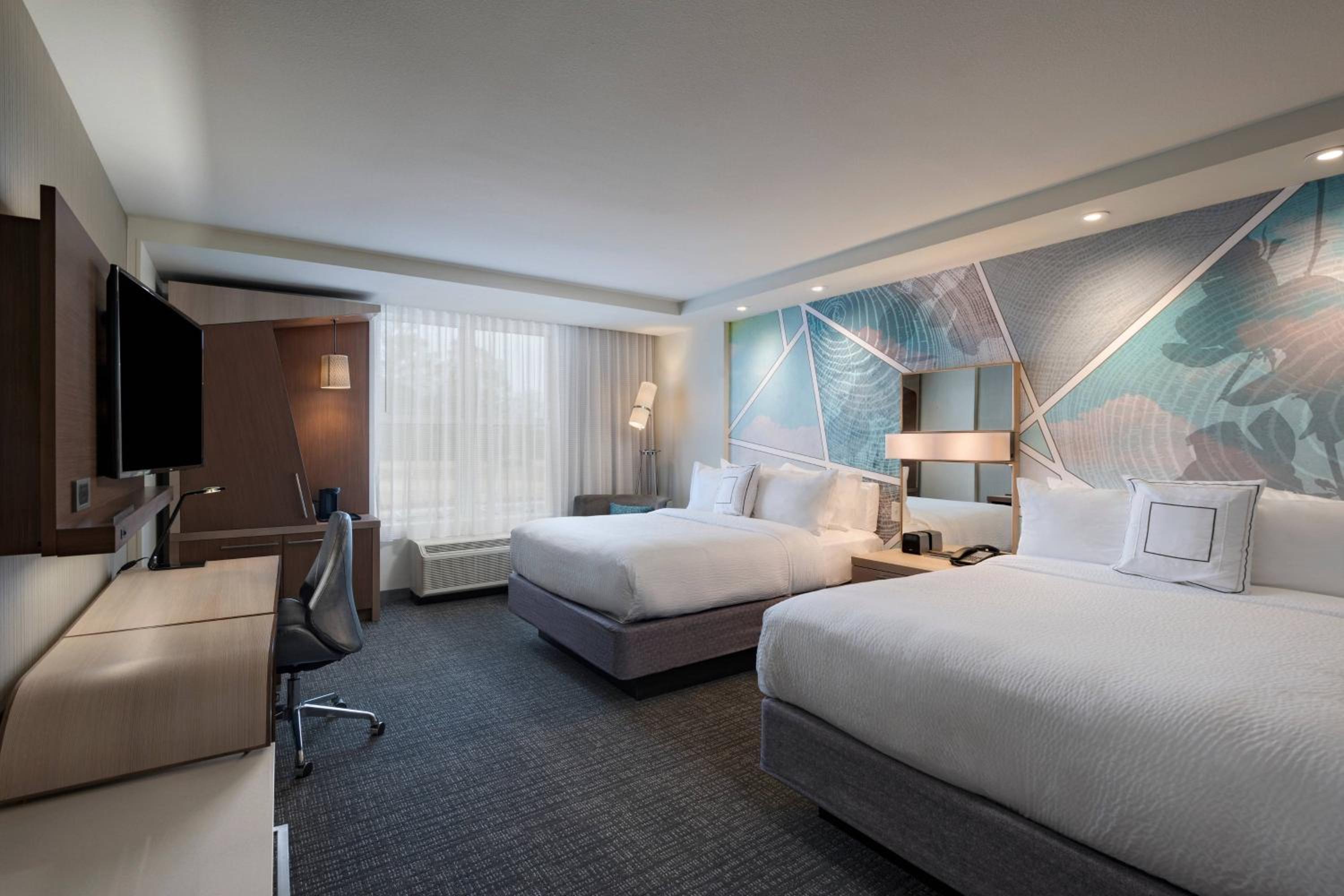 Queen Room with Two Queen Beds - Hearing Accessible photo 1