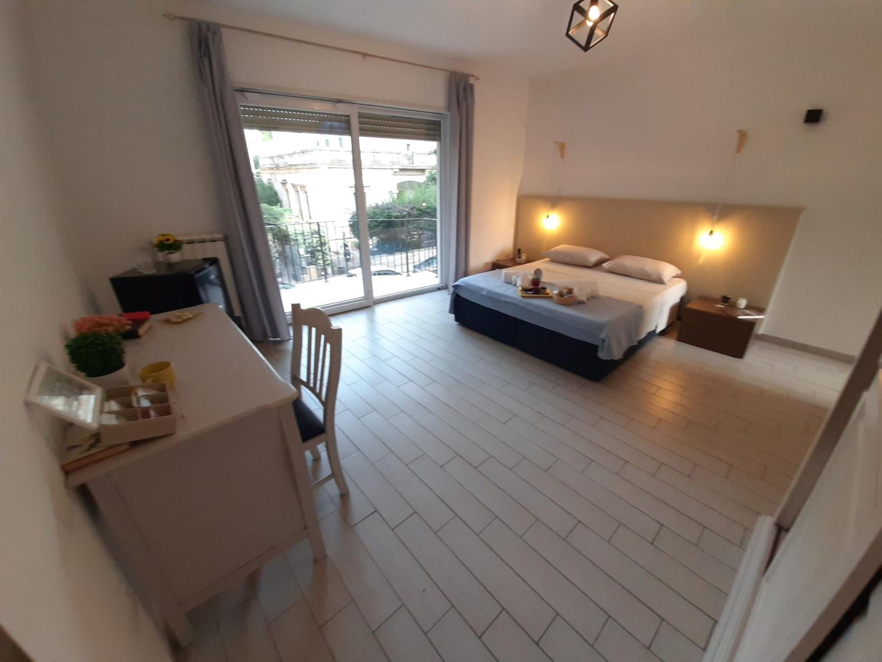 One-Bedroom Apartment with Balcony and City View photo 3