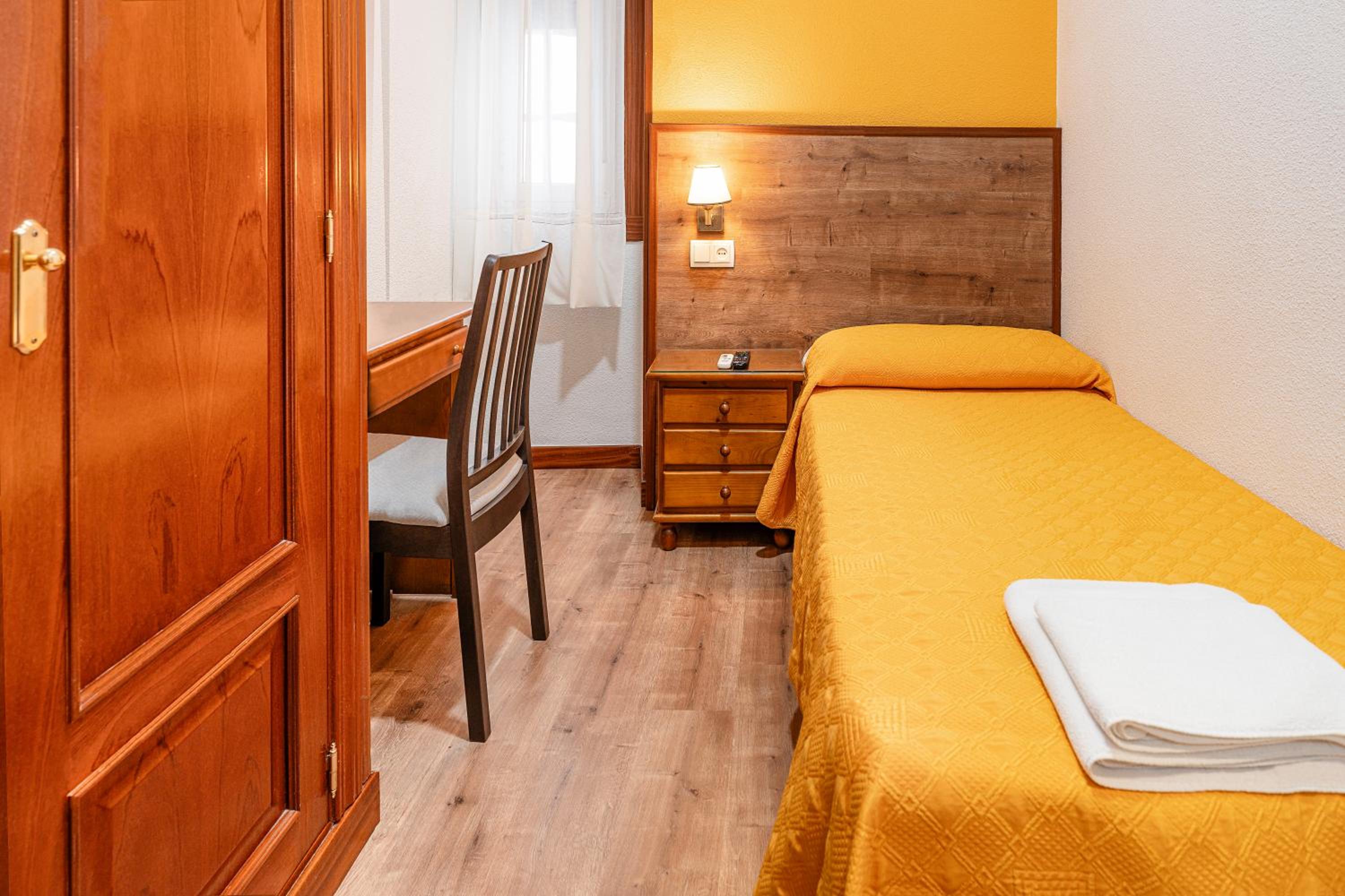 Habitación individual con baño compartido