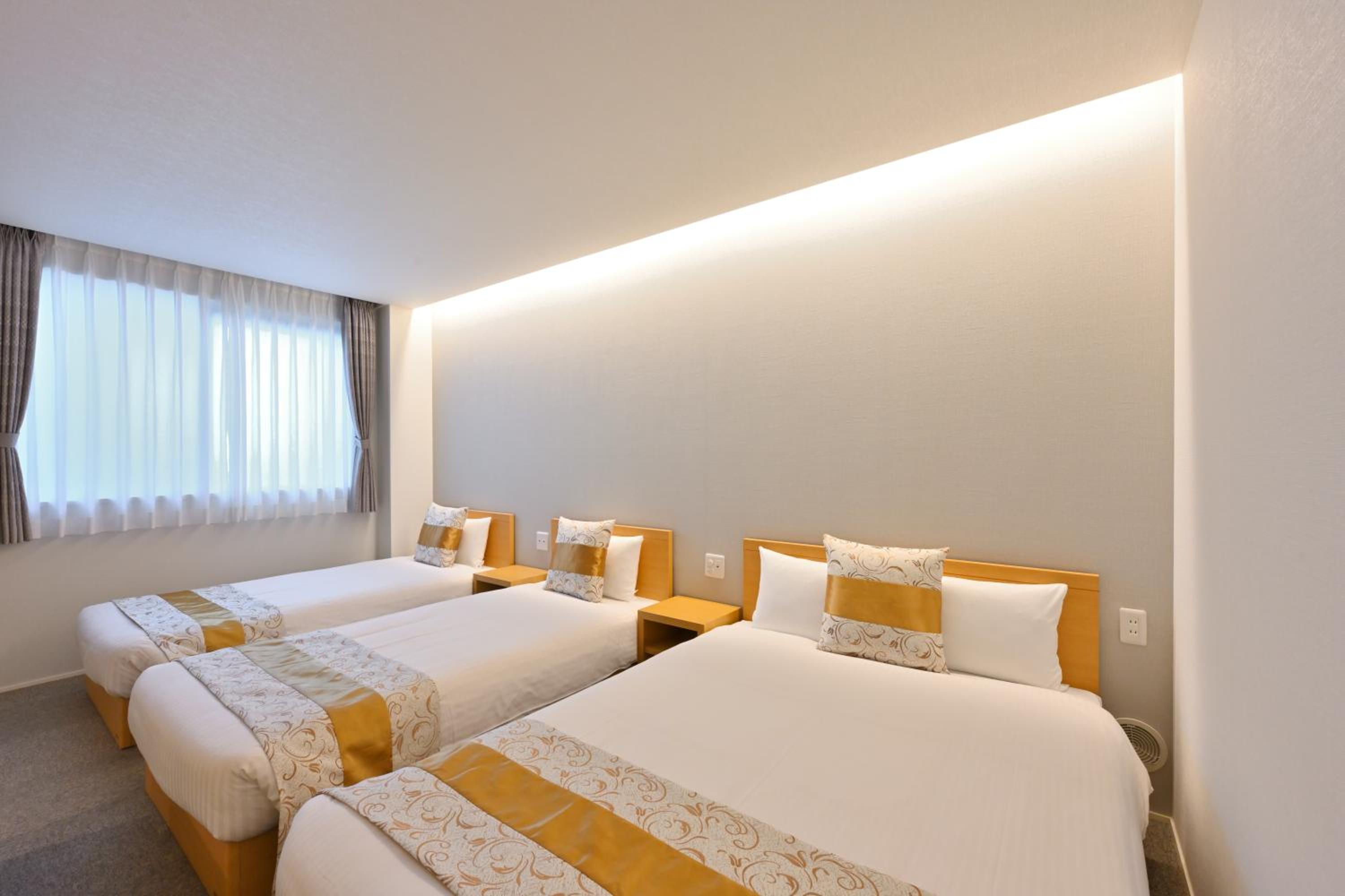 Deluxe Triple Room - Photo 20