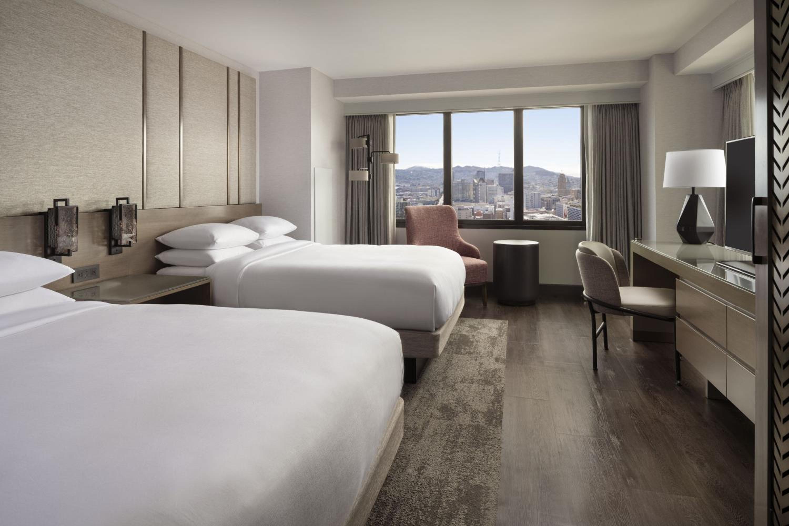 Deluxe Corner Queen Room with 2 Queen Beds and City View - Photo 1