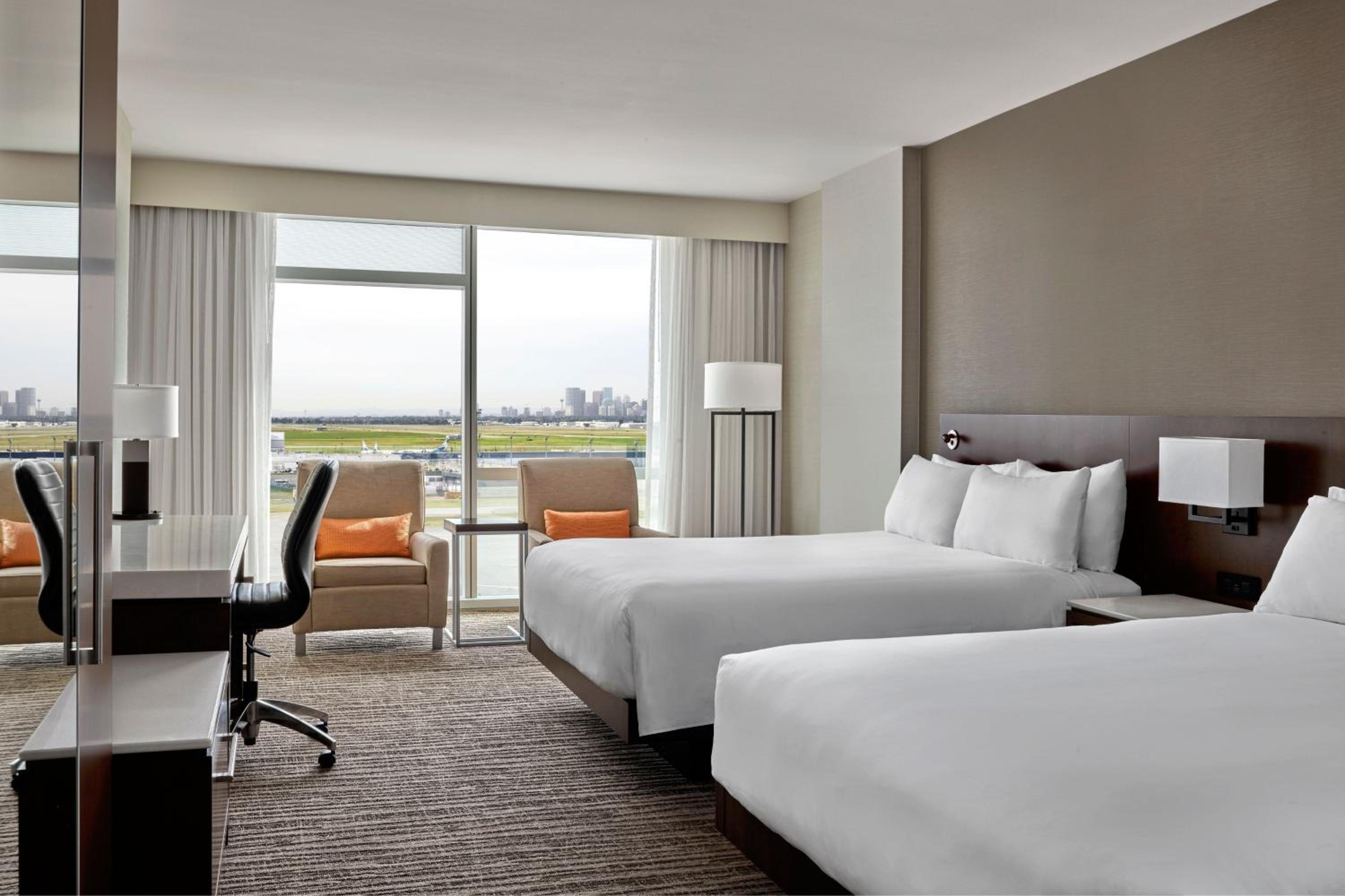 Queen Room with Two Queen Beds and Airport View