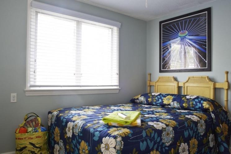 Petite Room with One Queen Bed- In Separate House photo 1