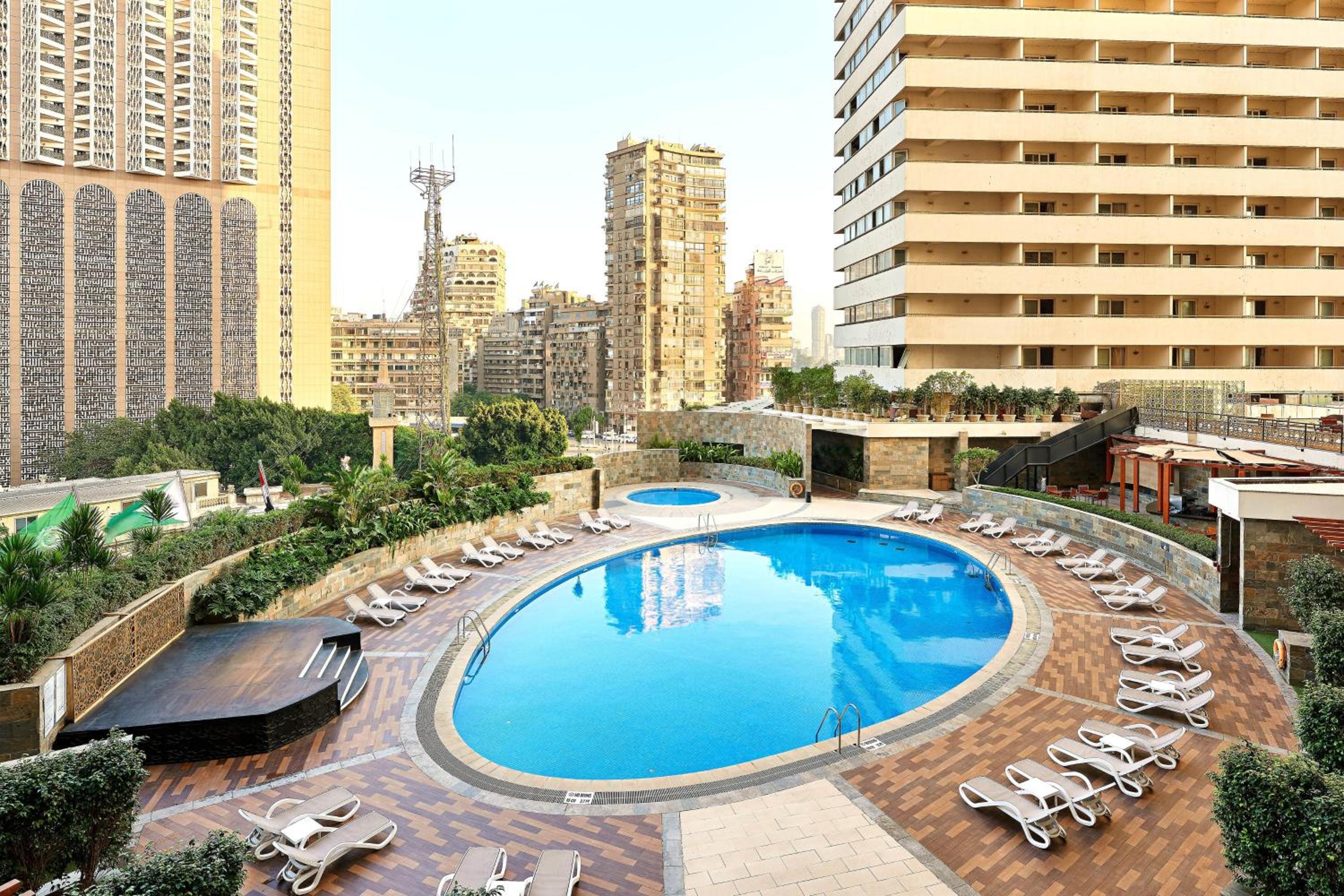 Deluxe Guest room, 1 King, Pool & City view, Balcony - Photo 5