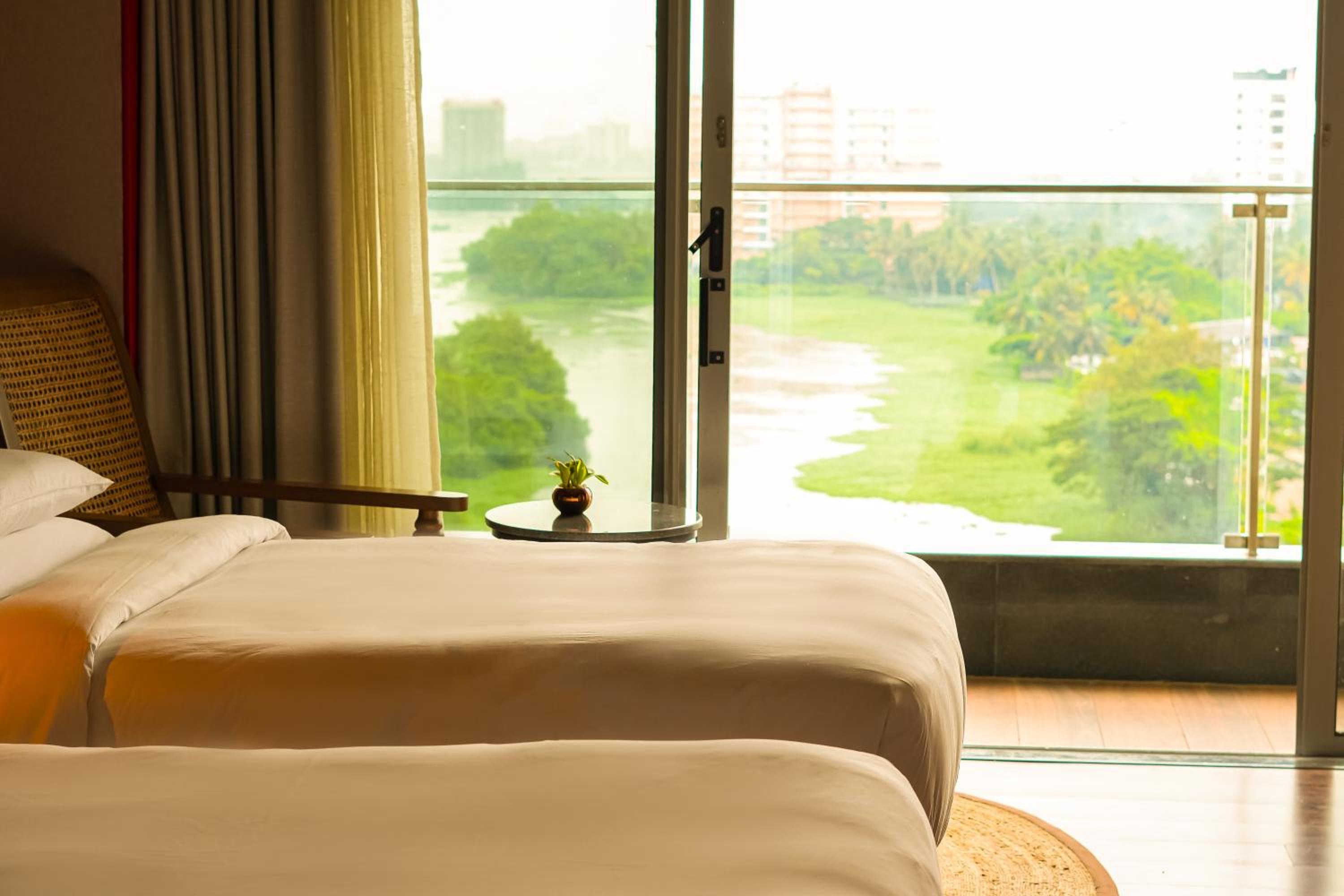 Twin Room with Backwaters View with Balcony , Happy Hours from 11 AM to 6.30 PM Twin Room with Backwaters View with Balcony , Happy Hours from 11 AM to 6.30 PM