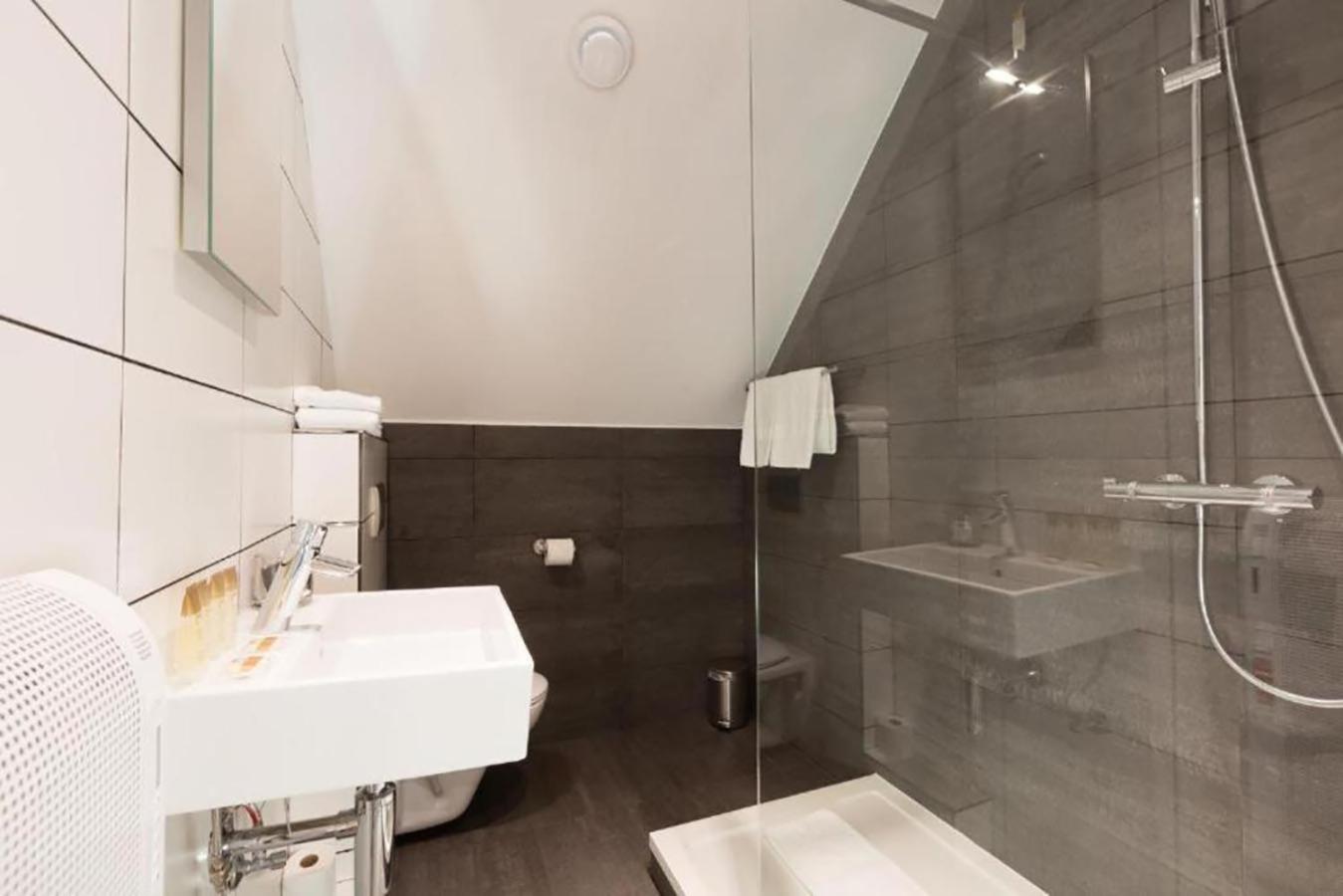 bathroom with a shower, sink, and bathtub