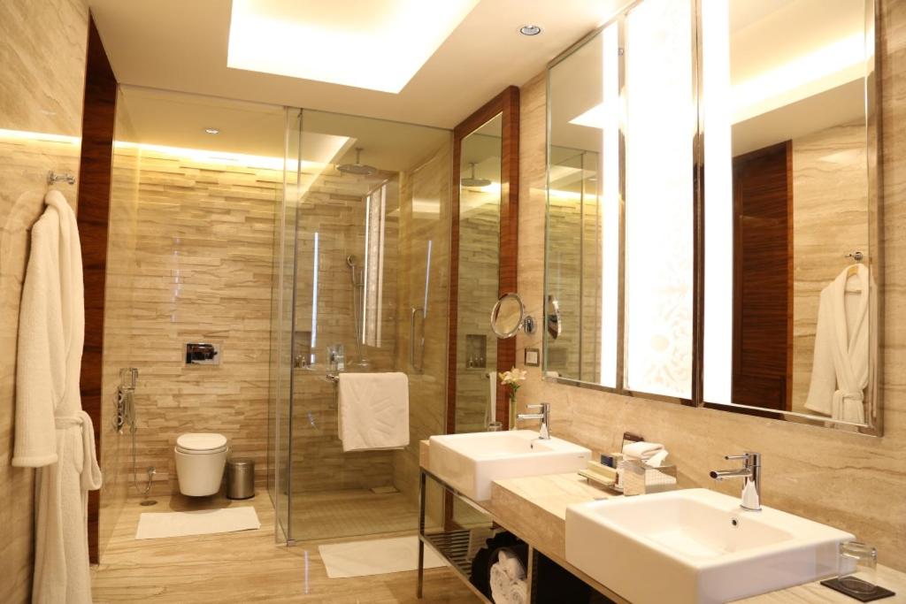 Luxury Suite with One way Airport Transfer, Butler service on request.02 Pcs of Ironing per day,20 % disc on FNSB,SPA & transportation, Cocktail Hours @ Club Lounge from 18:00 hrs to 20:00 hrs, 2 hours of boardroom usage per stay subject to availability Luxury Suite with One way Airport Transfer, Butler service on request.02 Pcs of Ironing per day,20 % disc on FNSB,SPA & transportation, Cocktail Hours @ Club Lounge from 18:00 hrs to 20:00 hrs, 2 hours of boardroom usage per stay subject to availability