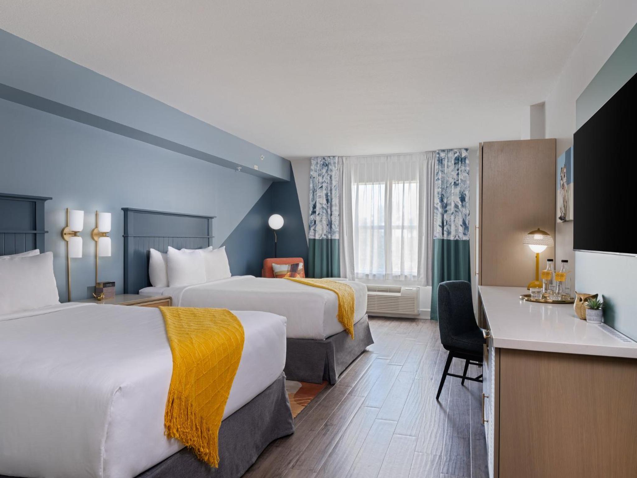 Premium Queen Room with Two Queen Beds - Photo 1