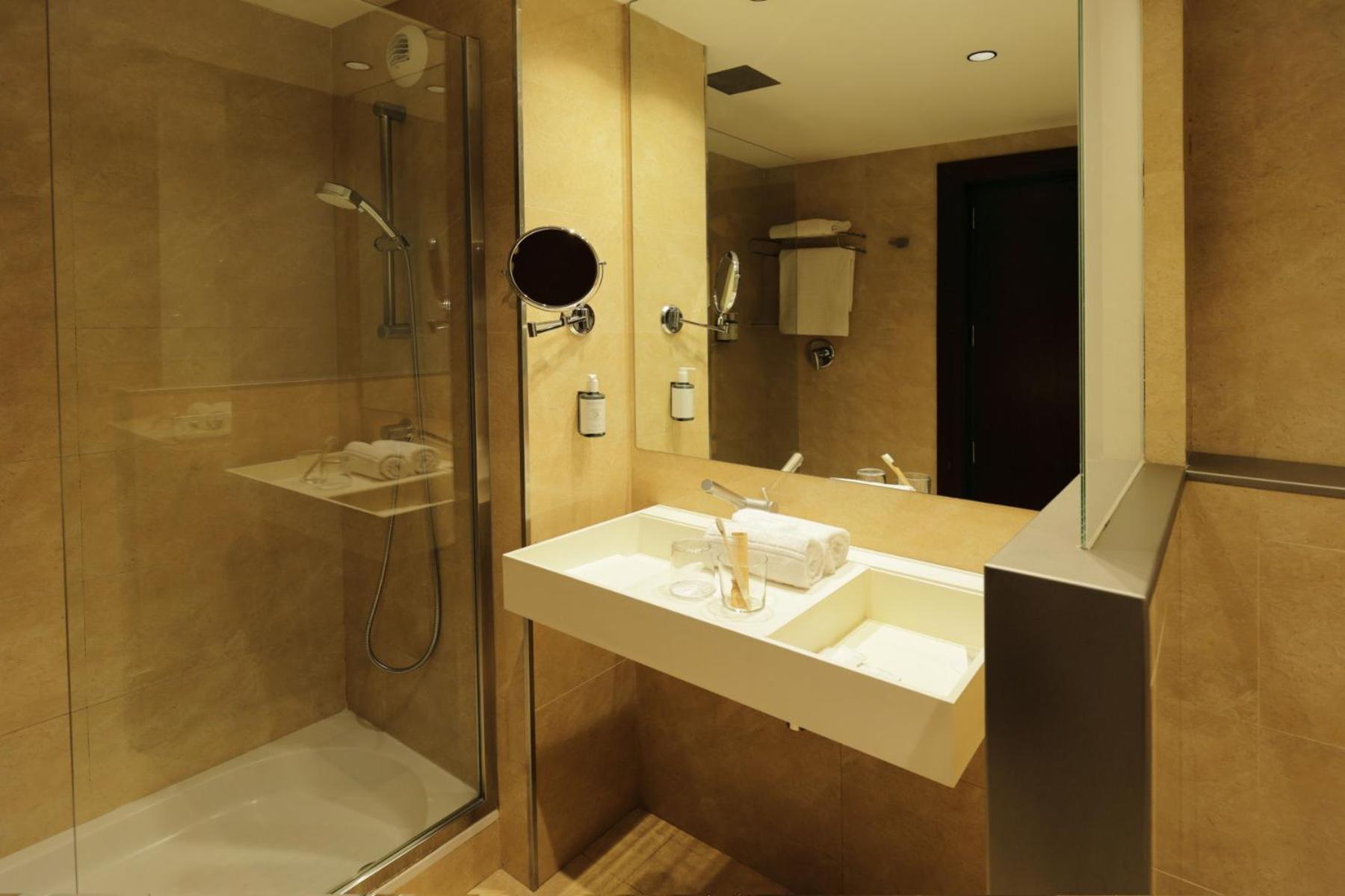 bathroom with a walk - in shower and a sink