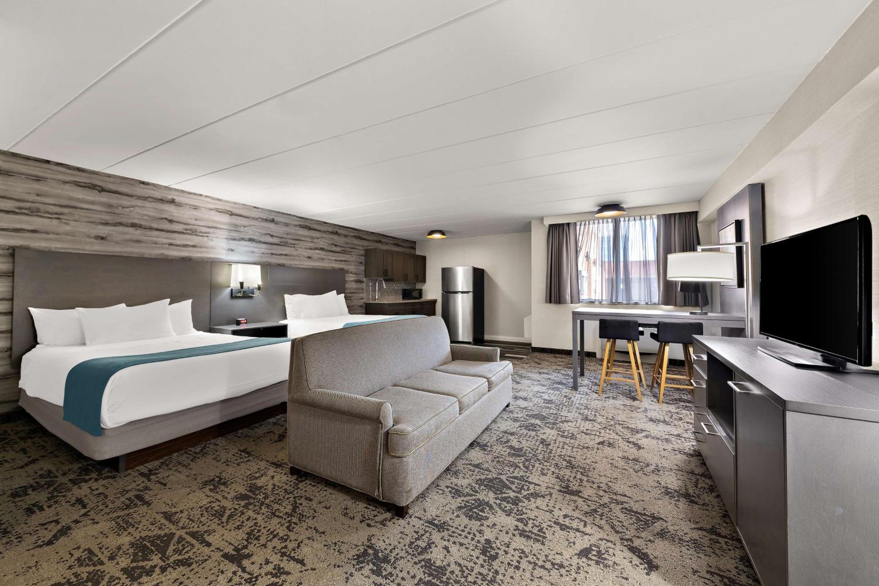 Queen Suite with Two Queen Beds, Sofa Bed, Kitchenette and Walk-In Shower - Non-Smoking