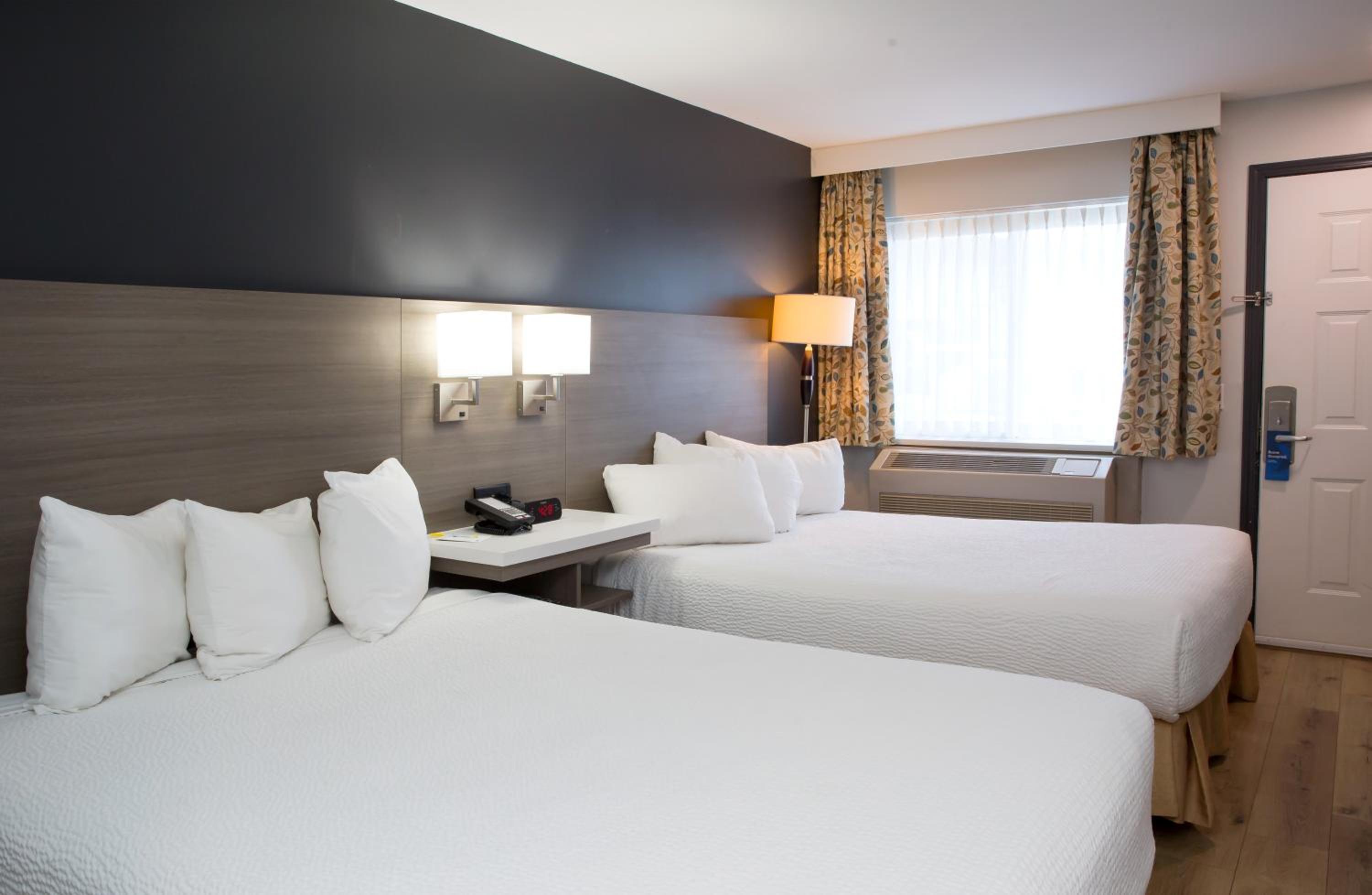 Queen Room with Two Queen Beds - Non-Smoking - Photo 1