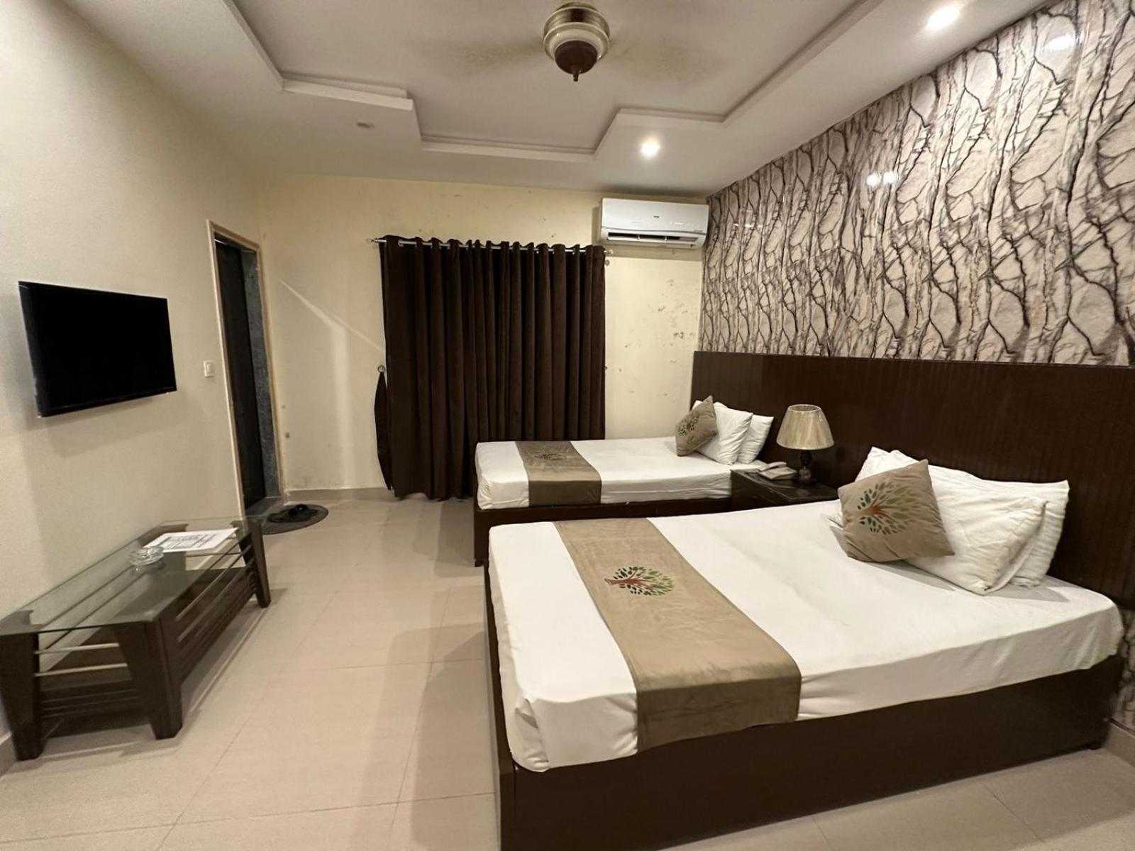 Deluxe Queen Room with Two Queen Beds photo 1