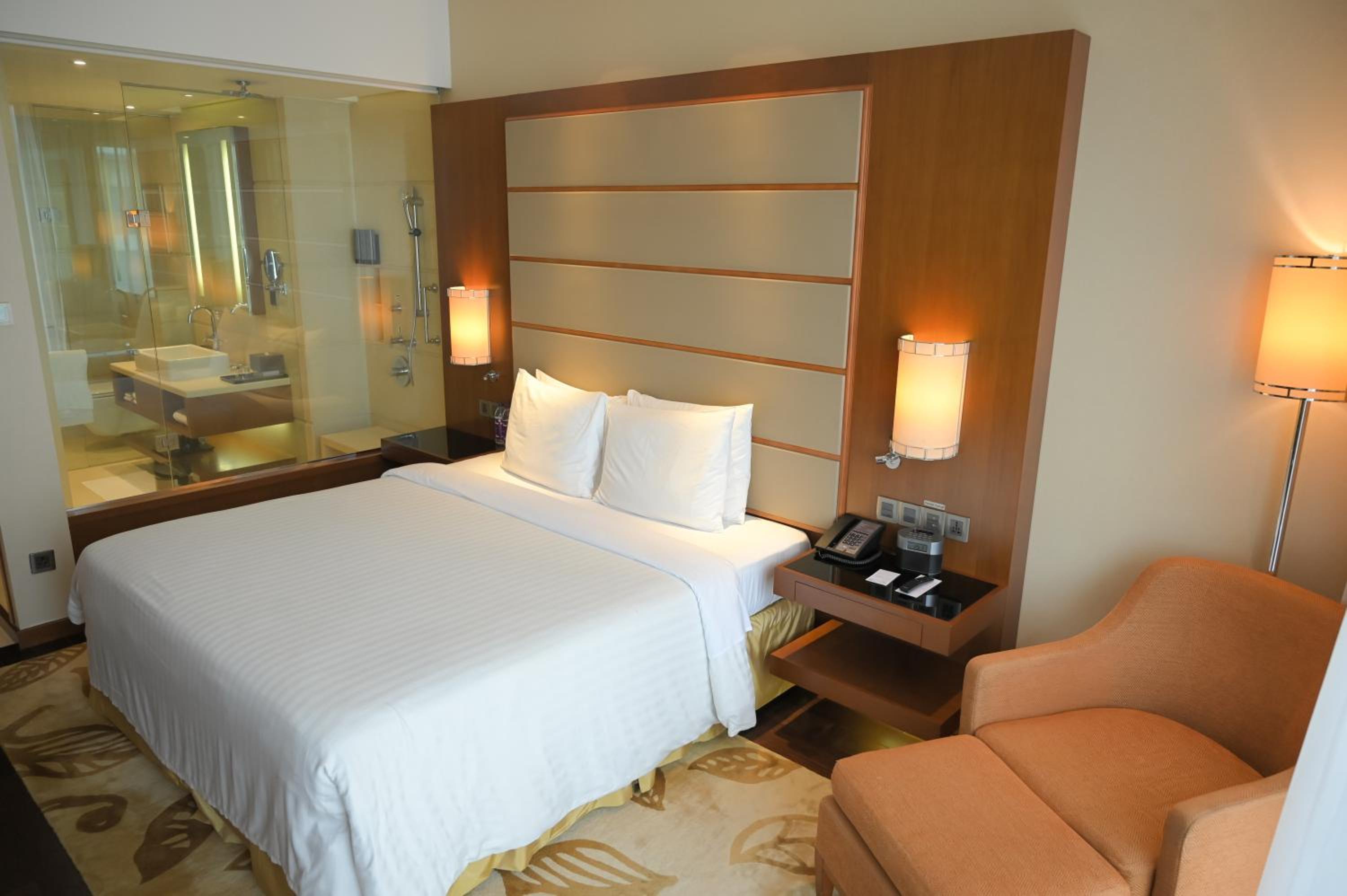 Executive King Room with complimentary Two-way airport transfers, Executive Lounge Access. INR 500 hotel credit inclusive of IRD (In-Room-Dining) per room per night, Access to Taberna Bar with unlimited beverages for two hours