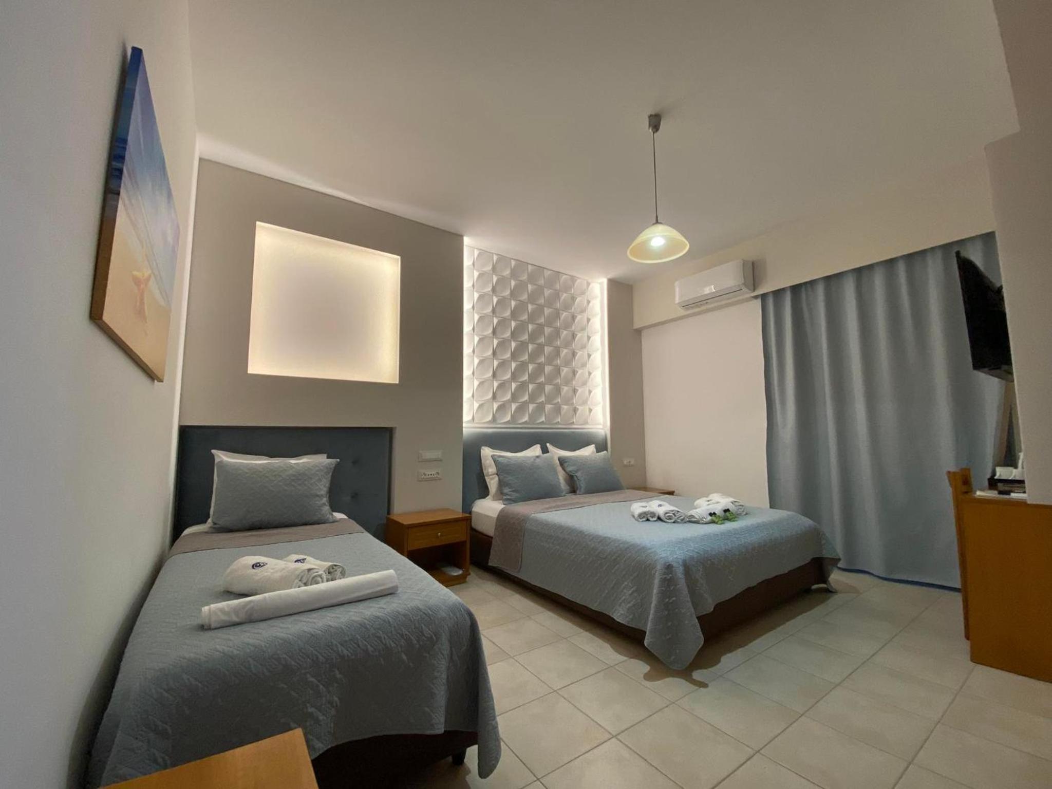 Deluxe Triple Room - Photo 21