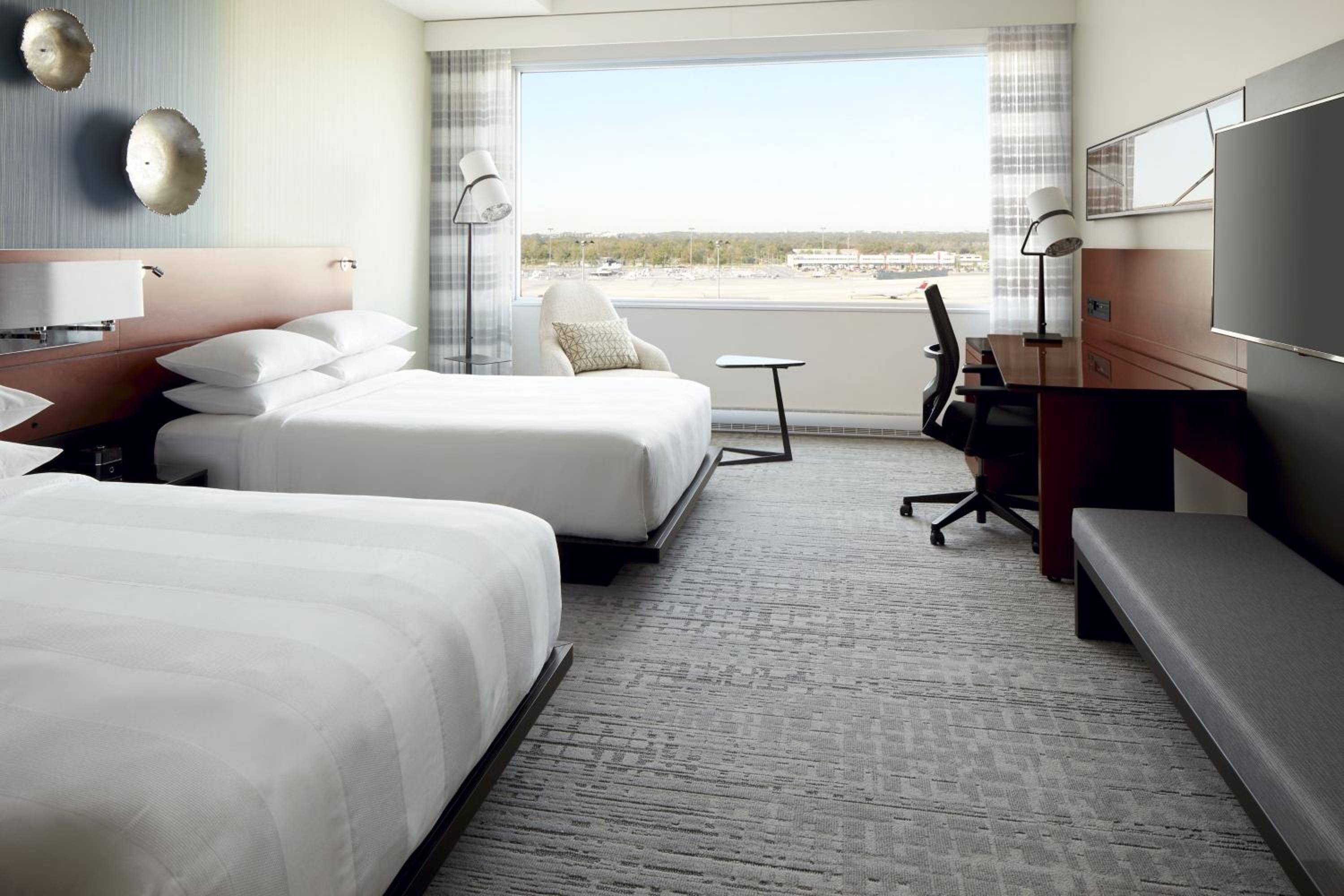 Guest Room with Two Queen Beds and Airport View - Photo 1