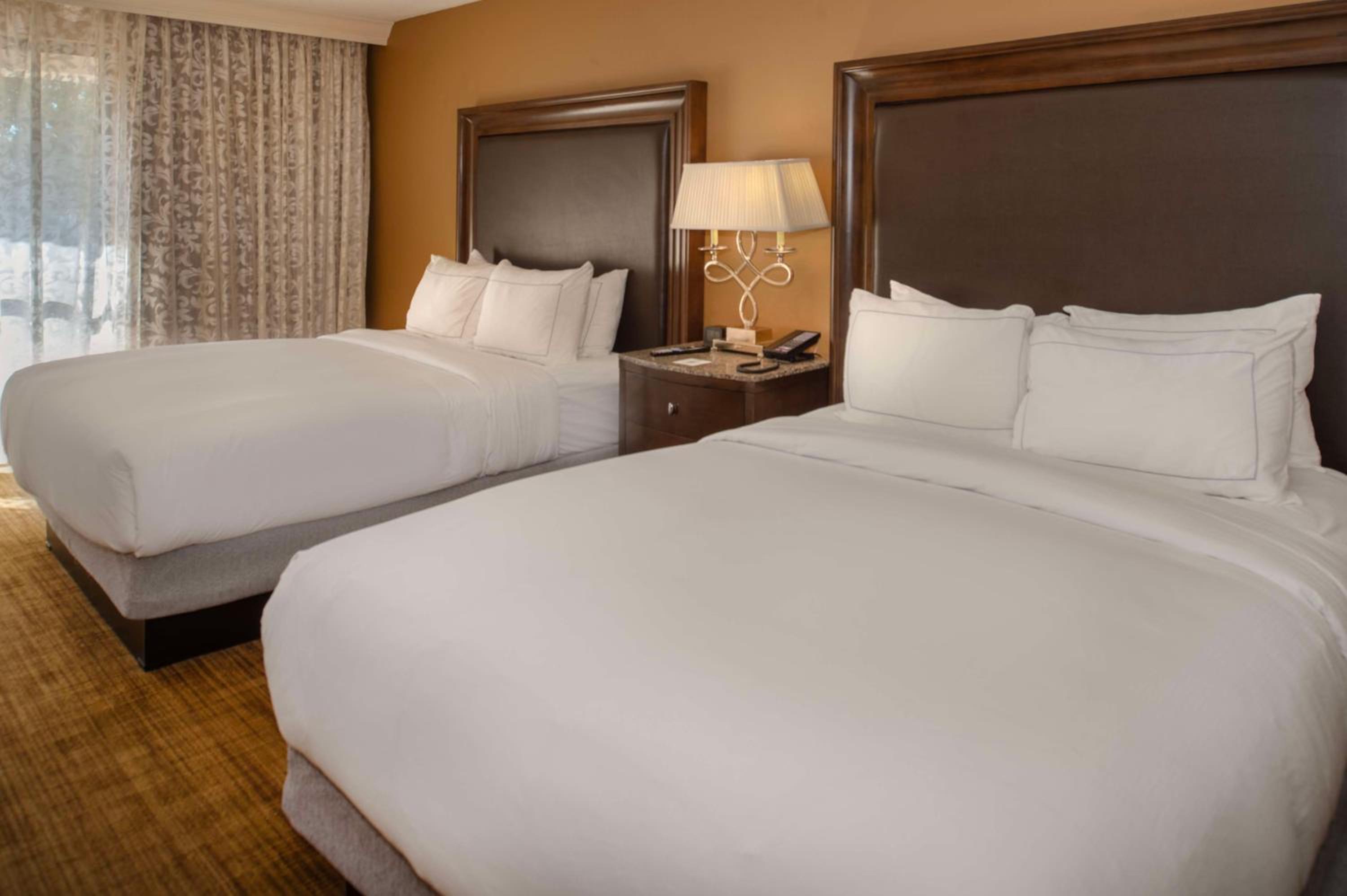 Queen Room with Two Queen Beds and Airport View - Photo 1