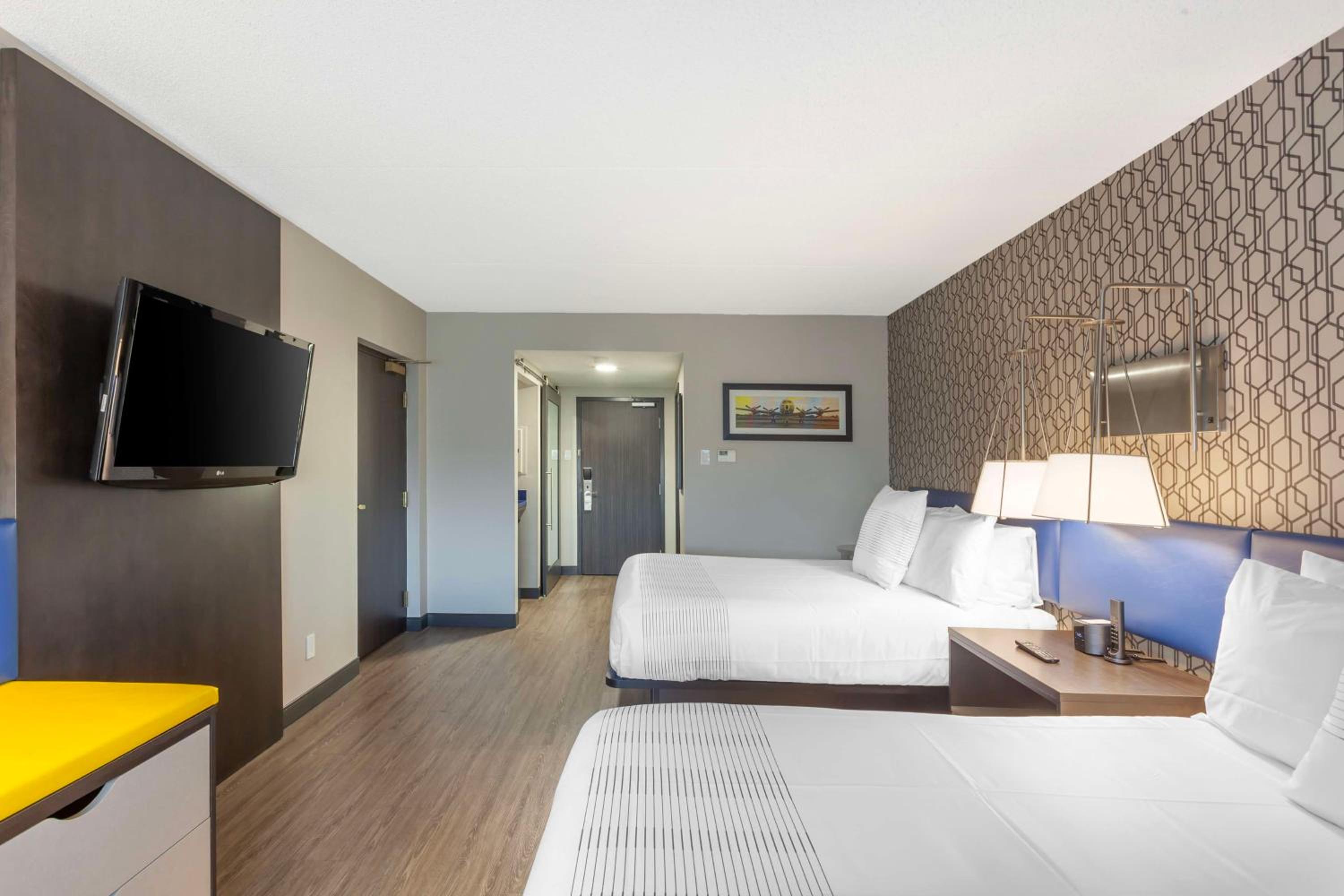 Queen Room with Two Queen Beds and Walk-In Shower - Photo 2