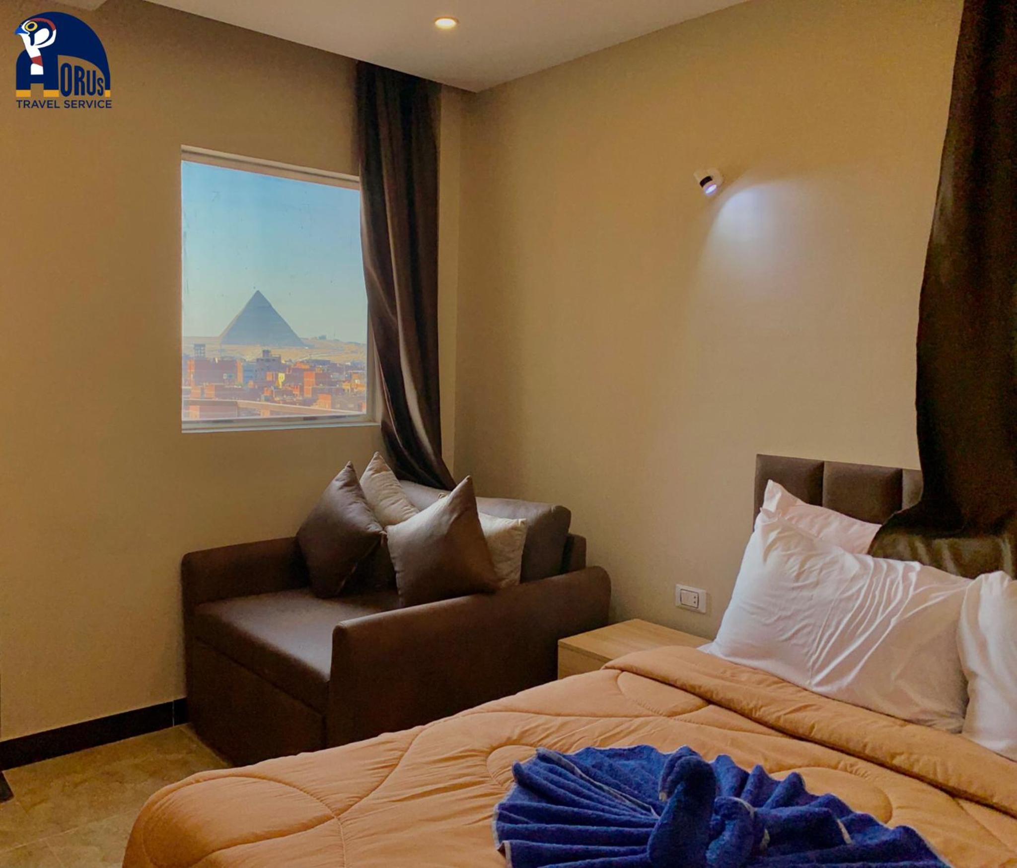 Family Room With Balcony And Pyramids View