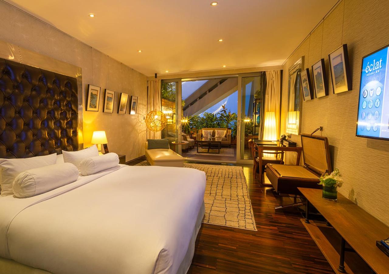 room with a big bed and a flat screen tv