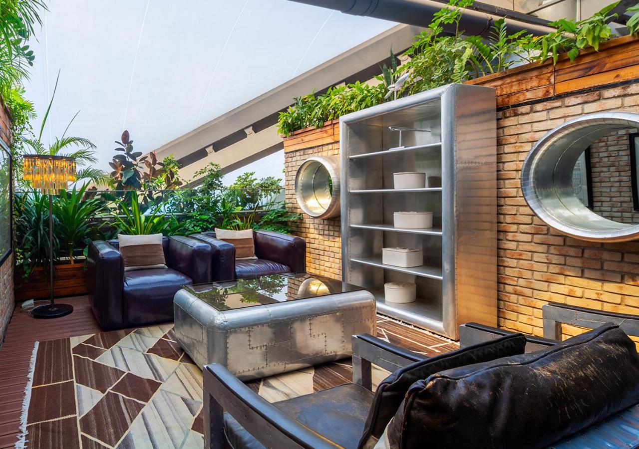 living room with a lot of plants on the roof