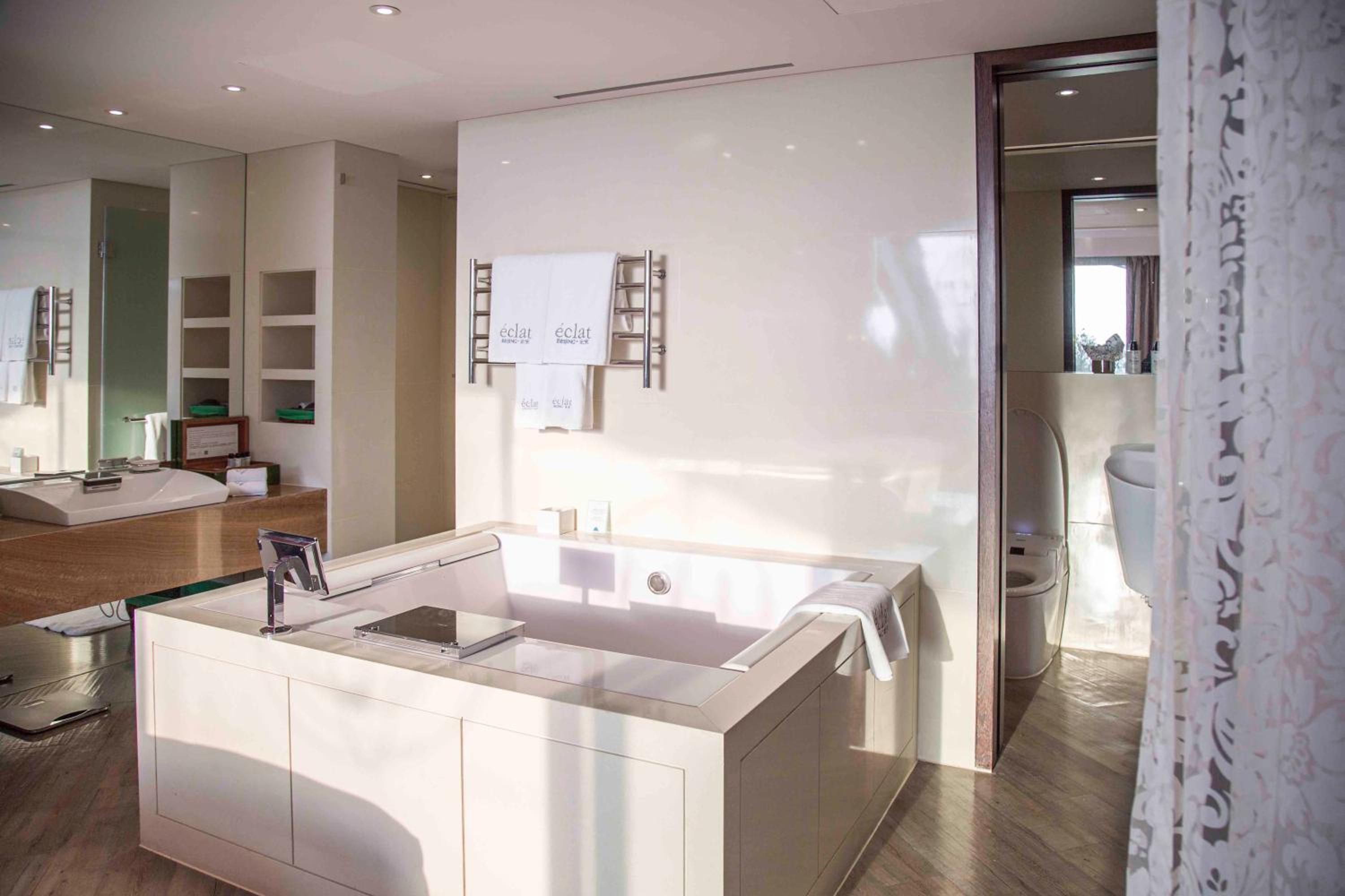 bathroom with a bathtub in the middle of the room