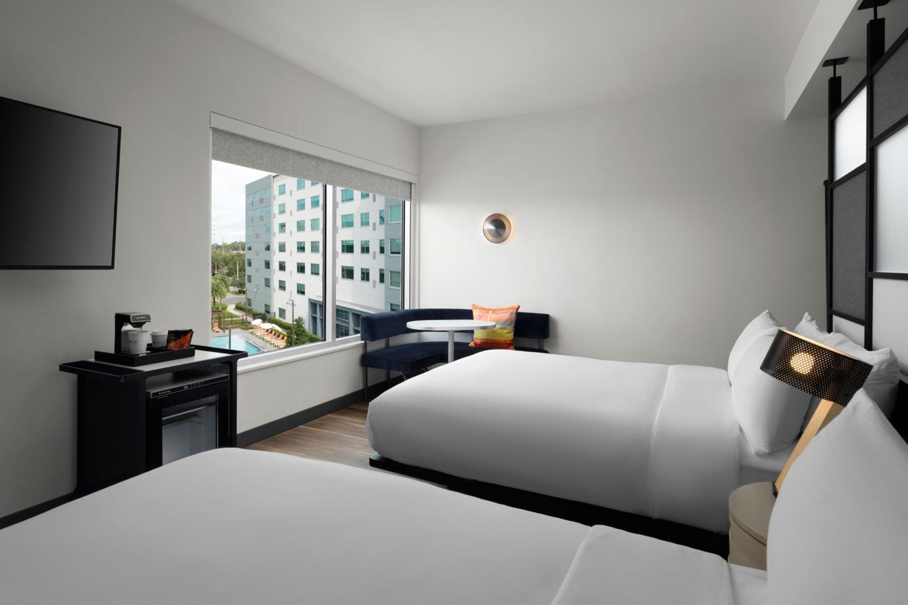 Queen Room with Two Queen Beds and Pool View - Hearing Accessible