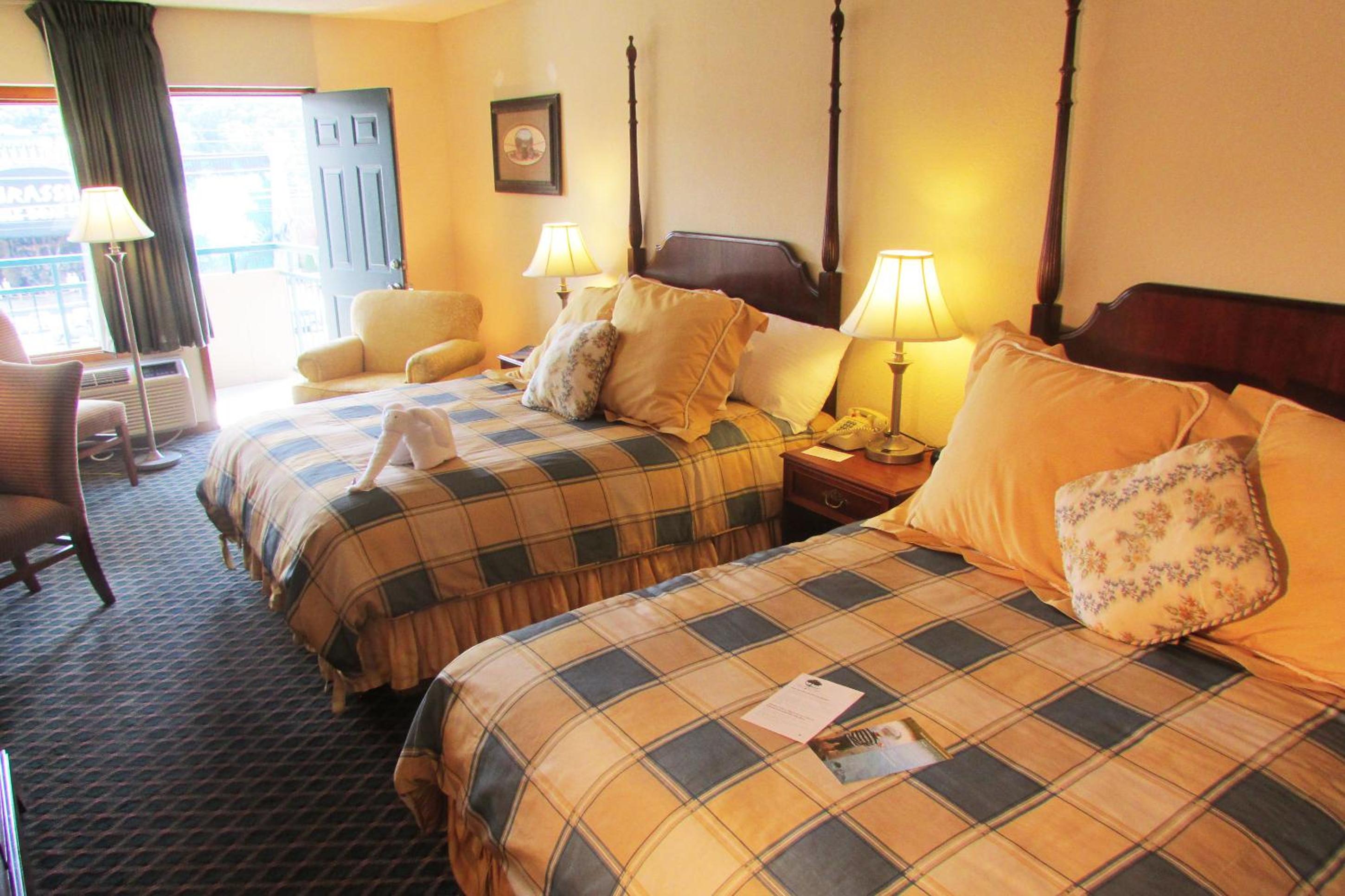 Superior Double Queen Room with Parkway View Shared Balcony with Rocking Chairs