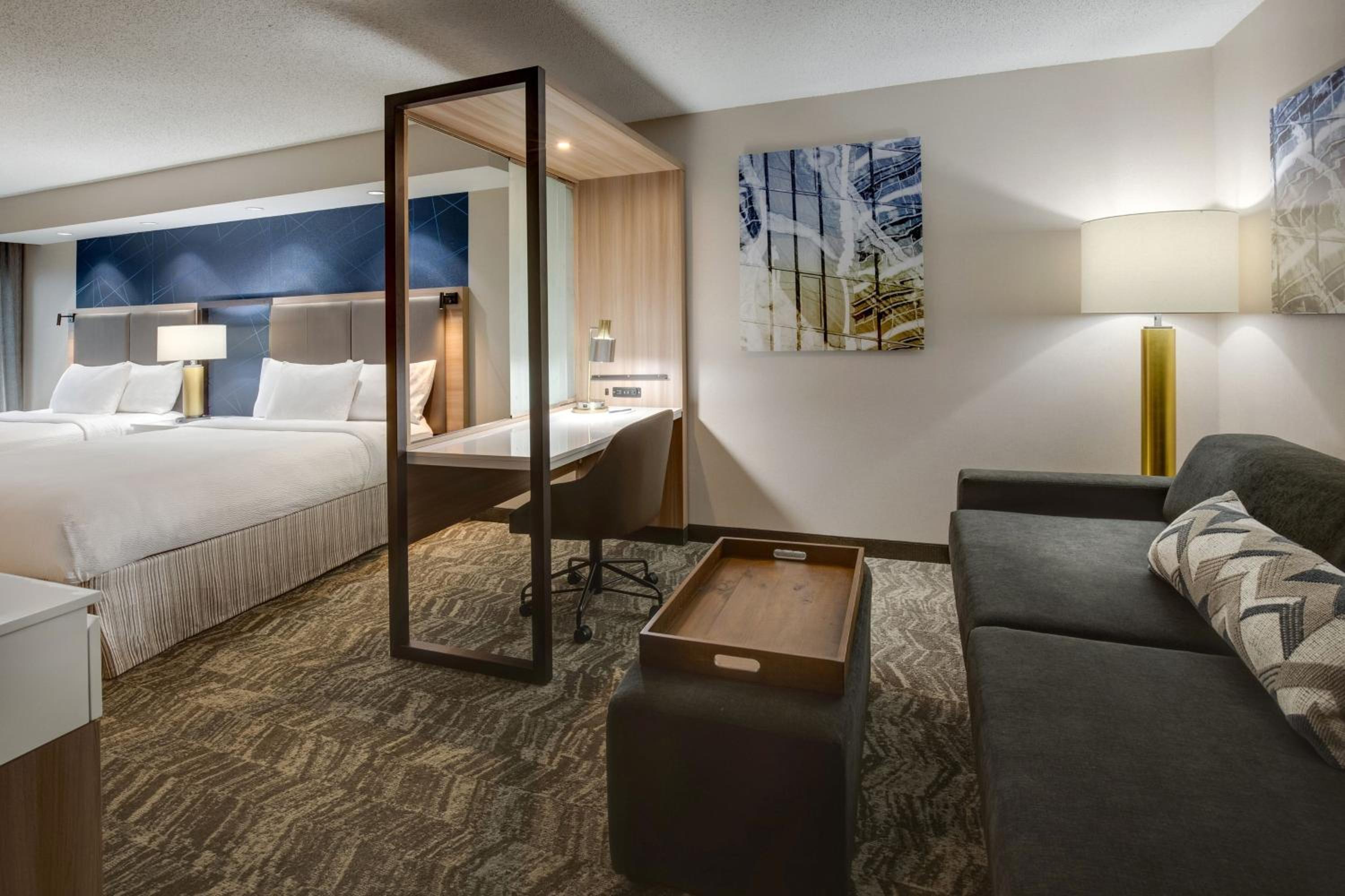 Queen Suite with Two Queen Beds and Sofa Bed - Photo 1