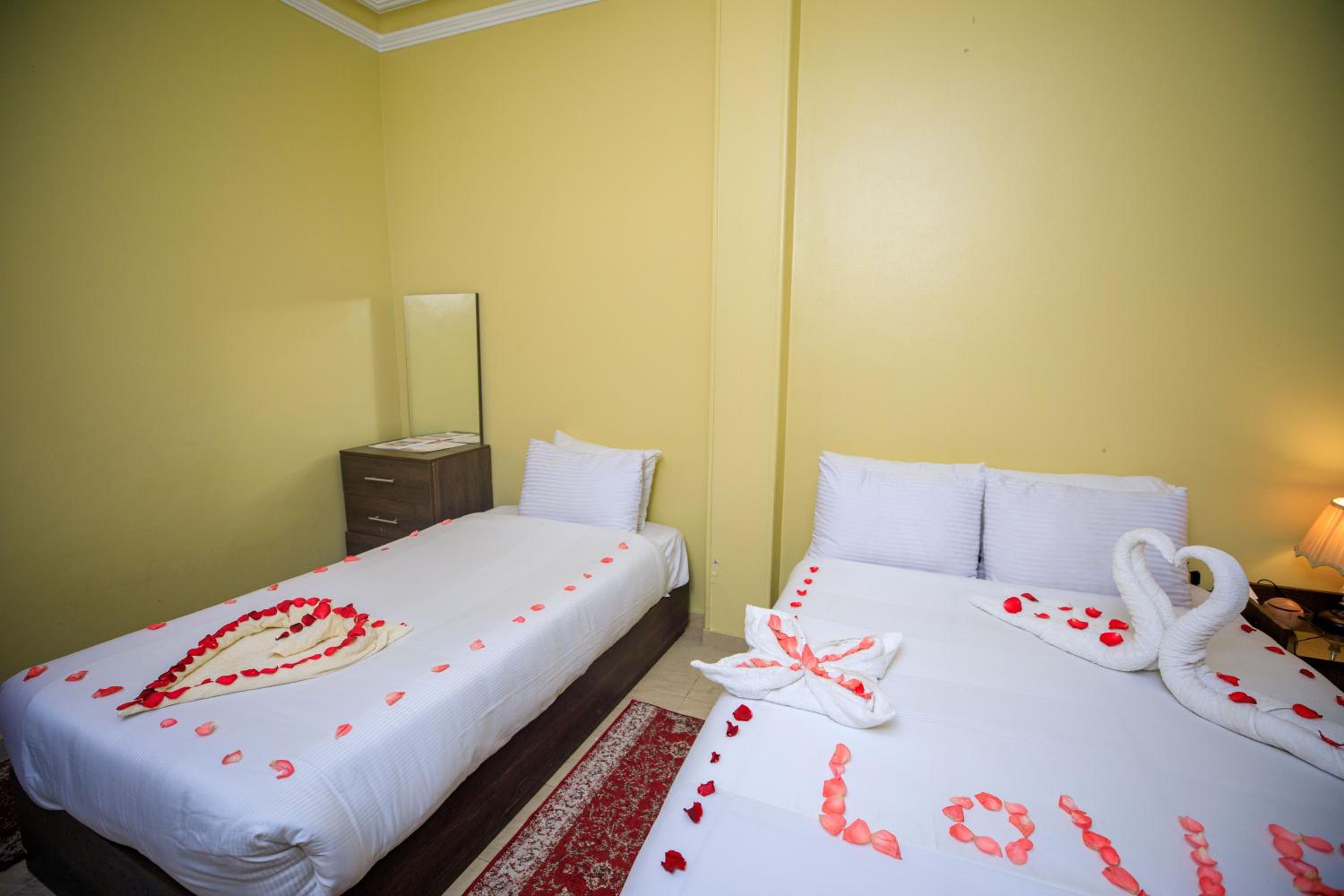 Deluxe Quadruple Room - Photo 14