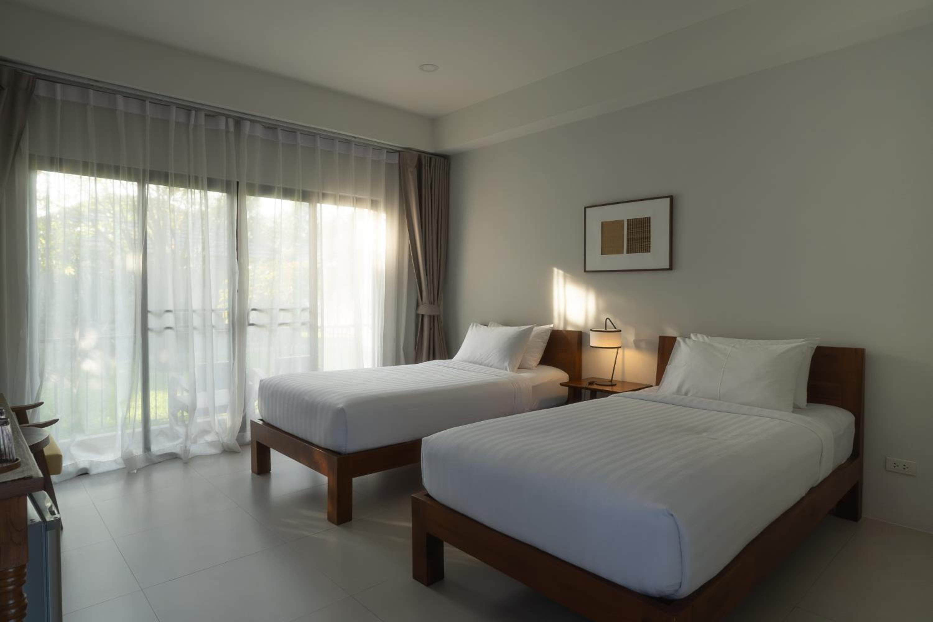 Cozy Deluxe Twin Beds - Photo 12