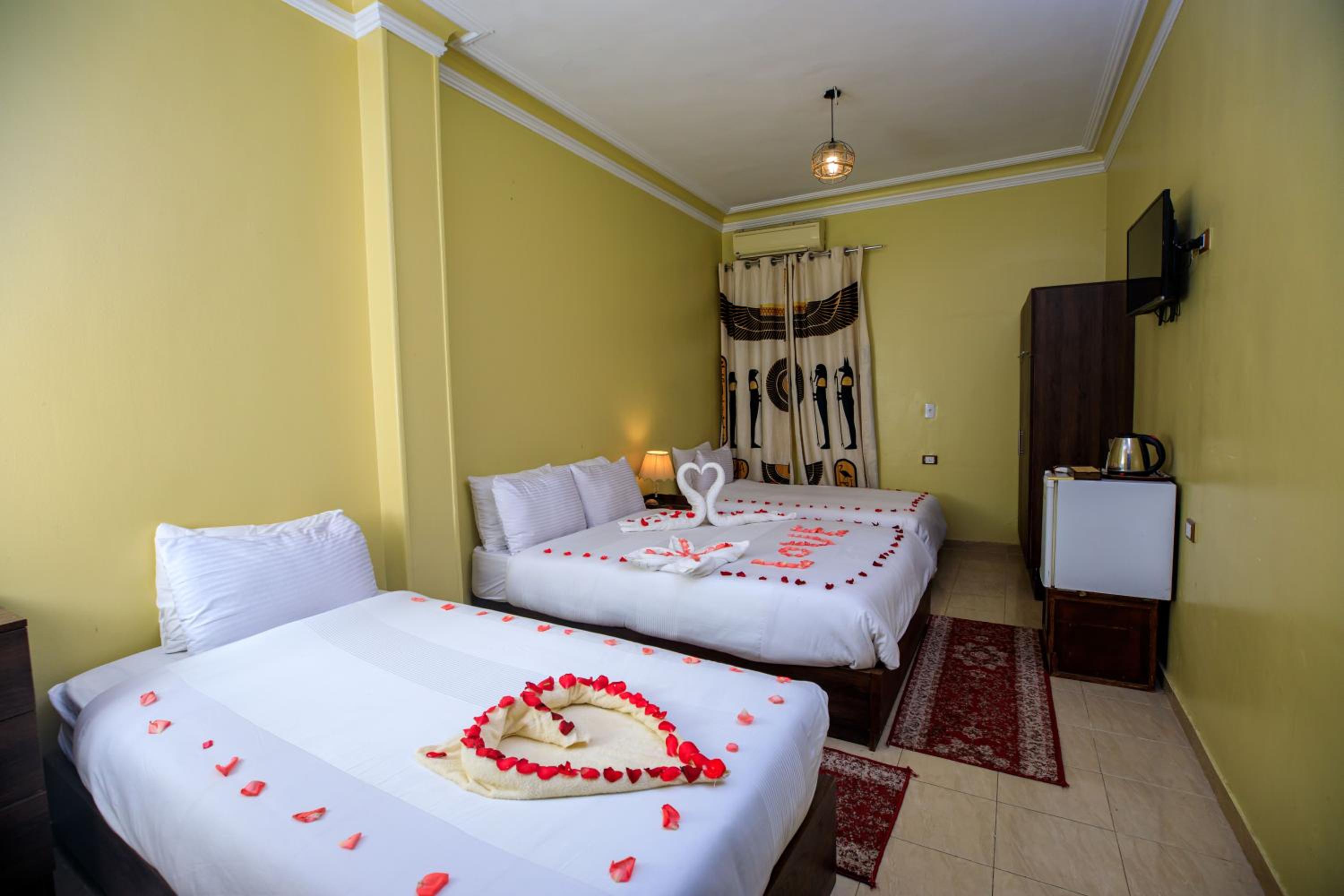 Deluxe Quadruple Room - Photo 8