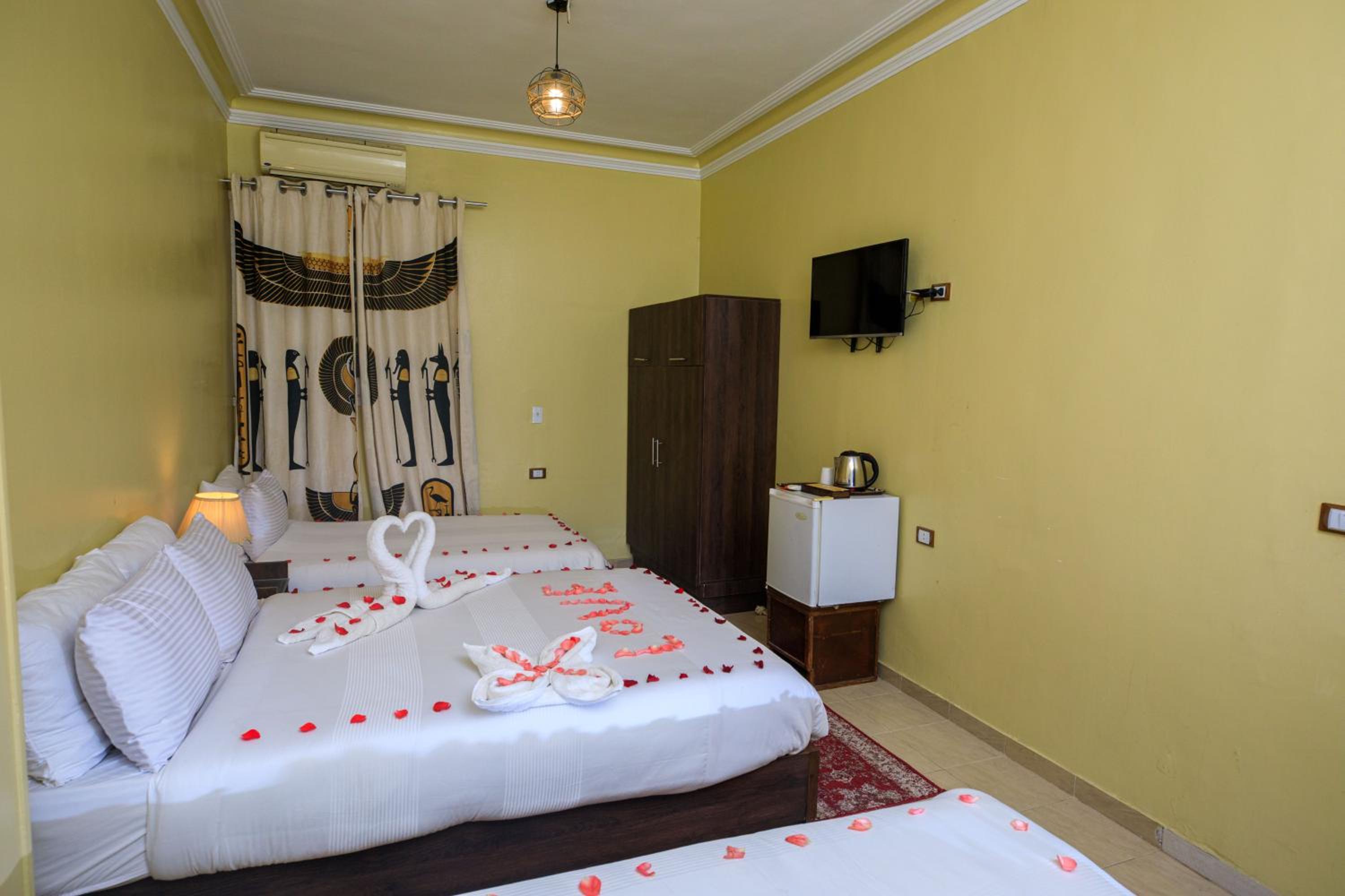 Deluxe Quadruple Room - Photo 12