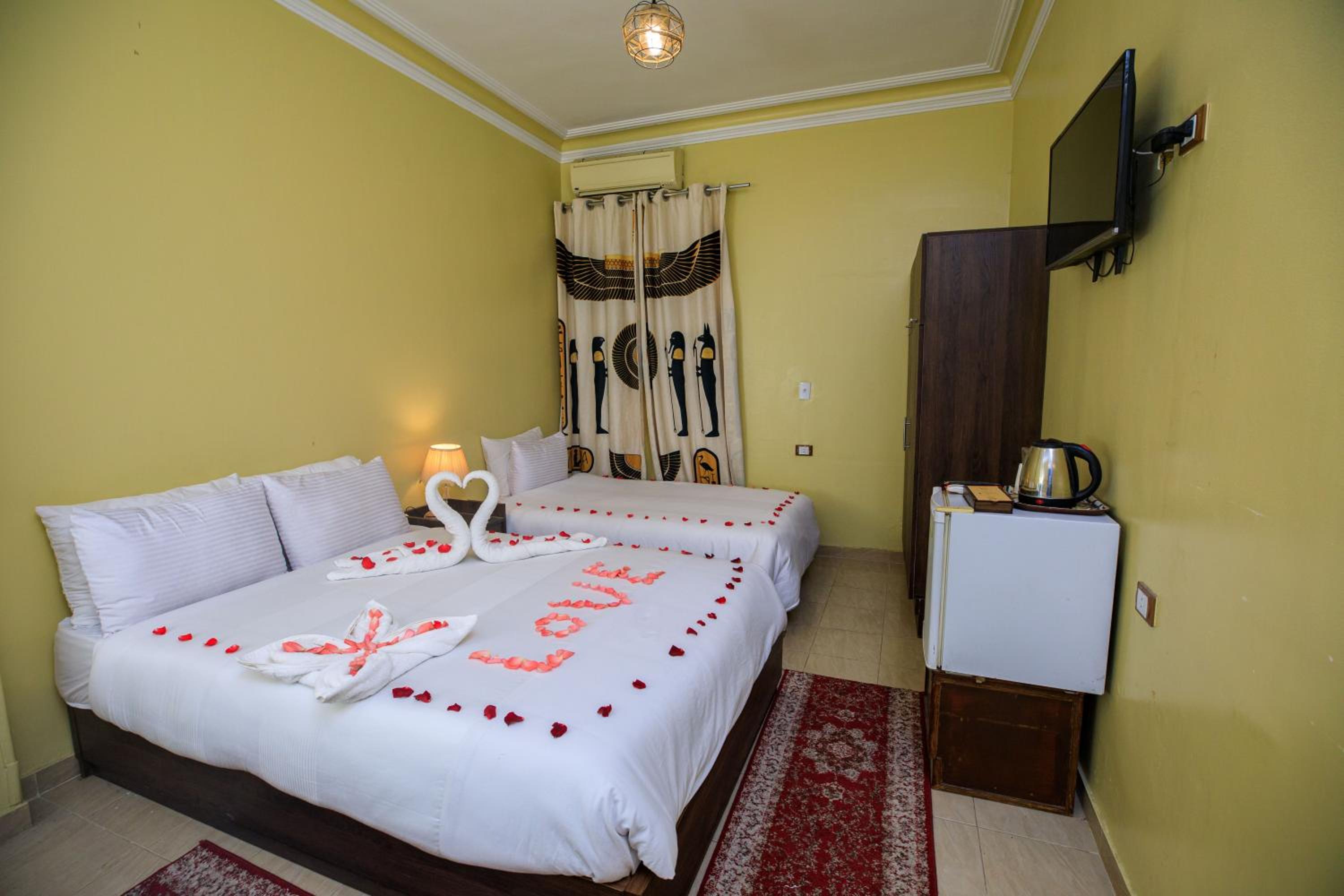 Deluxe Quadruple Room - Photo 11
