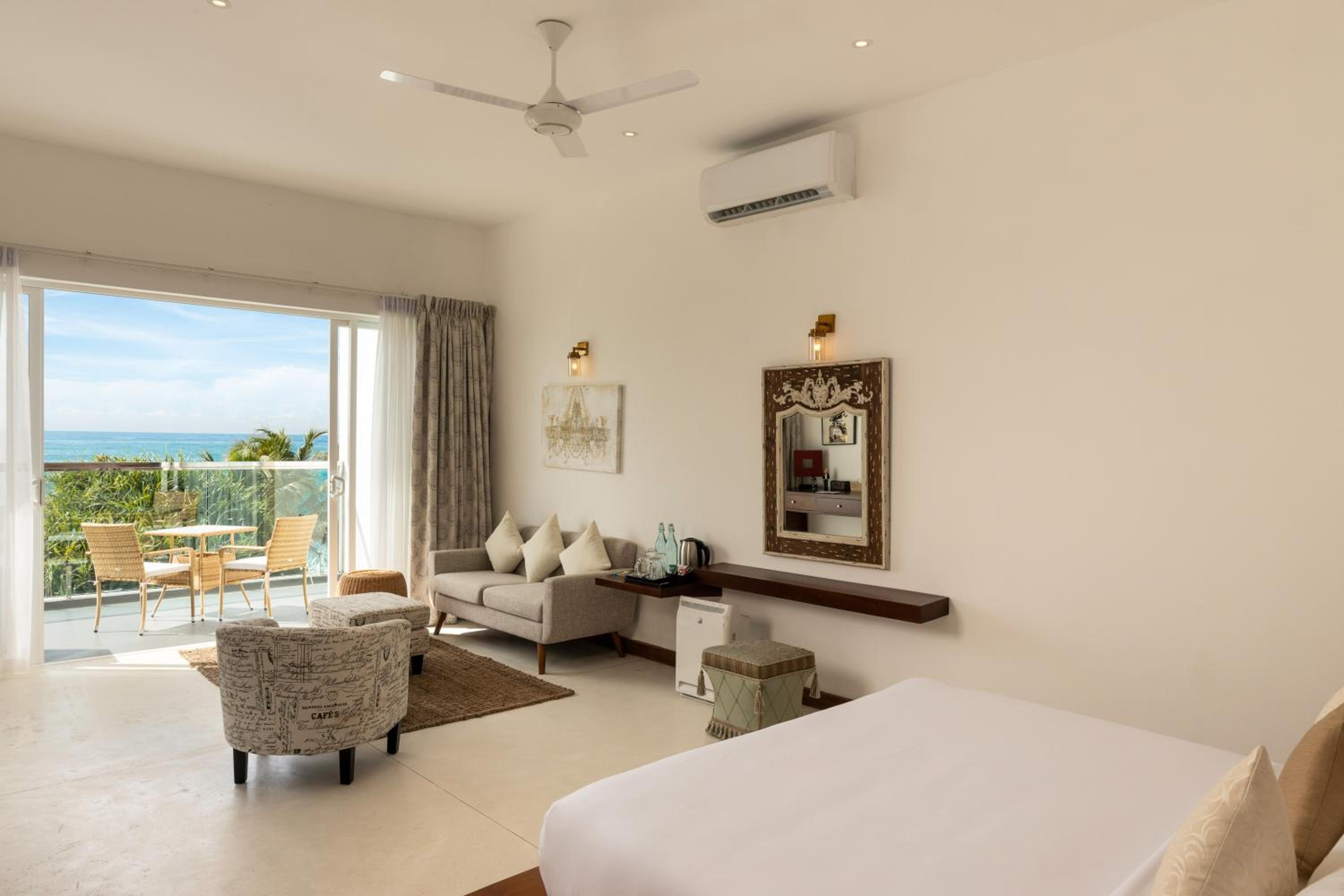 King Suite with Ocean View with homemade Sorbet, a tropical evening mocktail, local snacks with tea/coffee, and a dining experience by the white sands