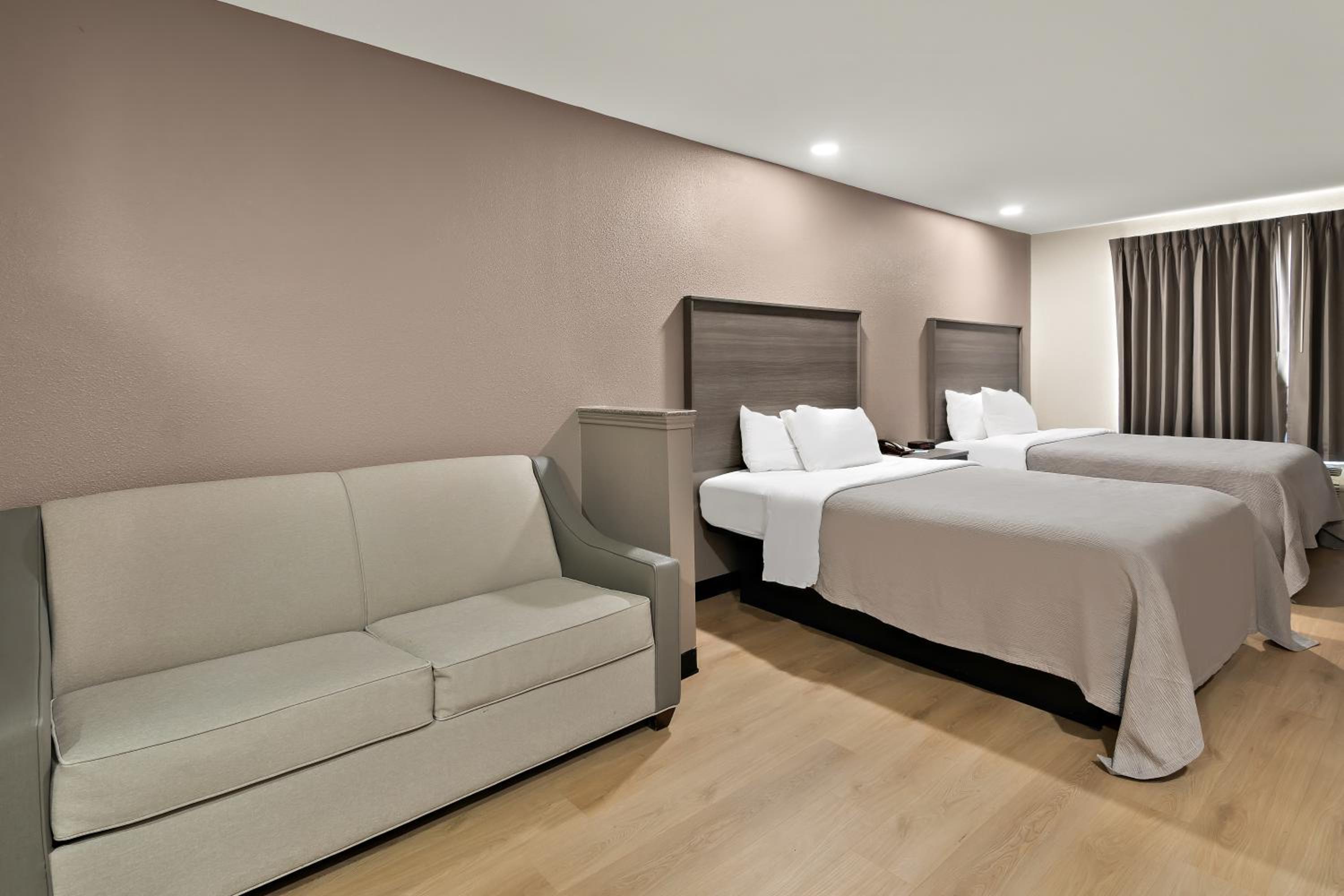 Queen Suite with Two Queen Beds and Sofa - Non Smoking/Interior Hall - Photo 8