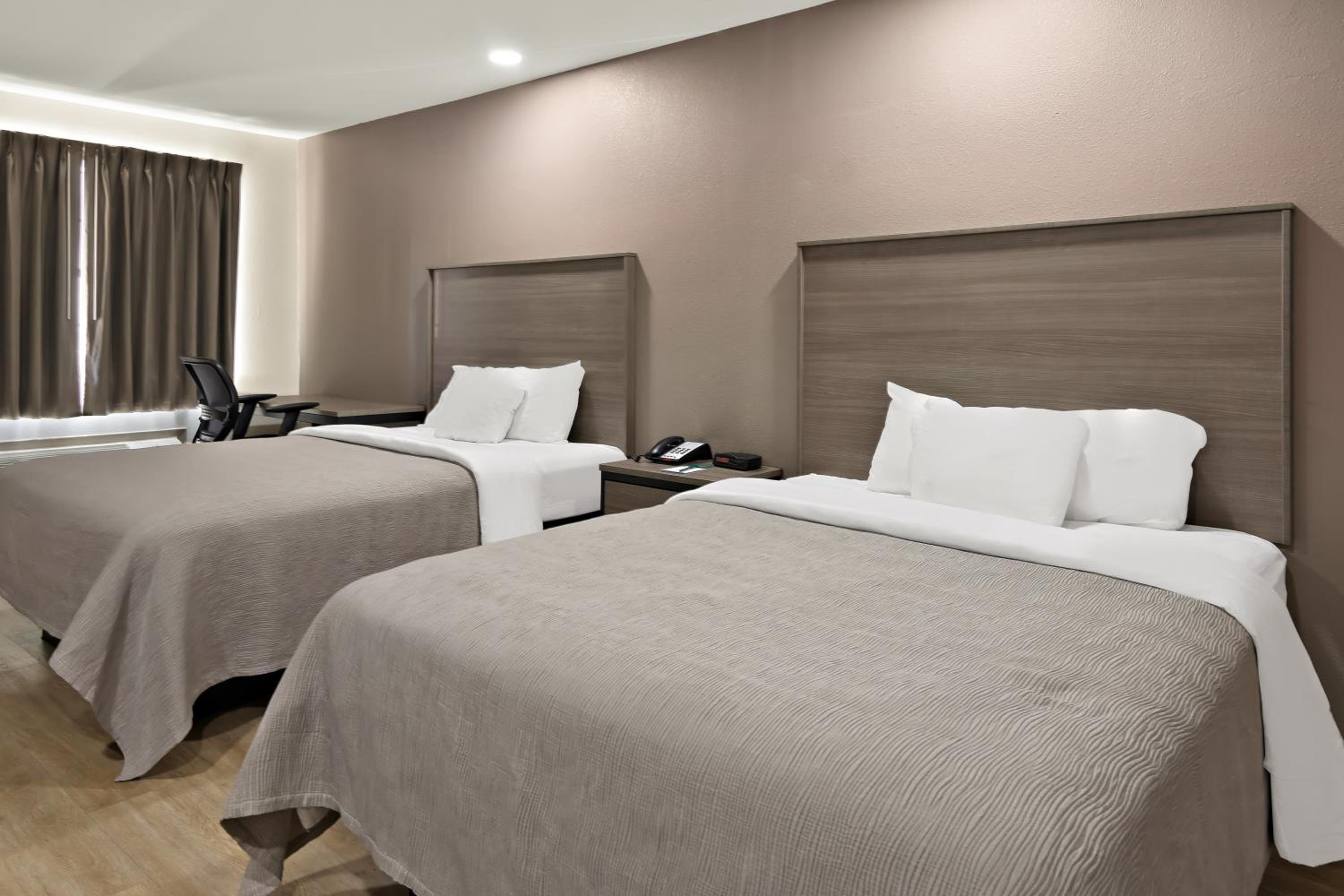 Queen Suite with Two Queen Beds and Sofa - Non Smoking/Interior Hall - Photo 1