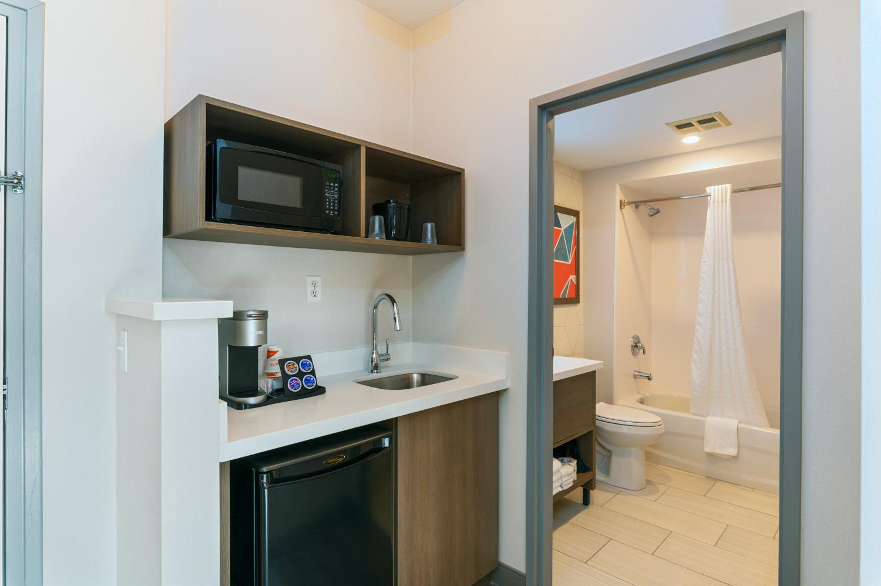kitchen with a sink, microwave, and dishwasher