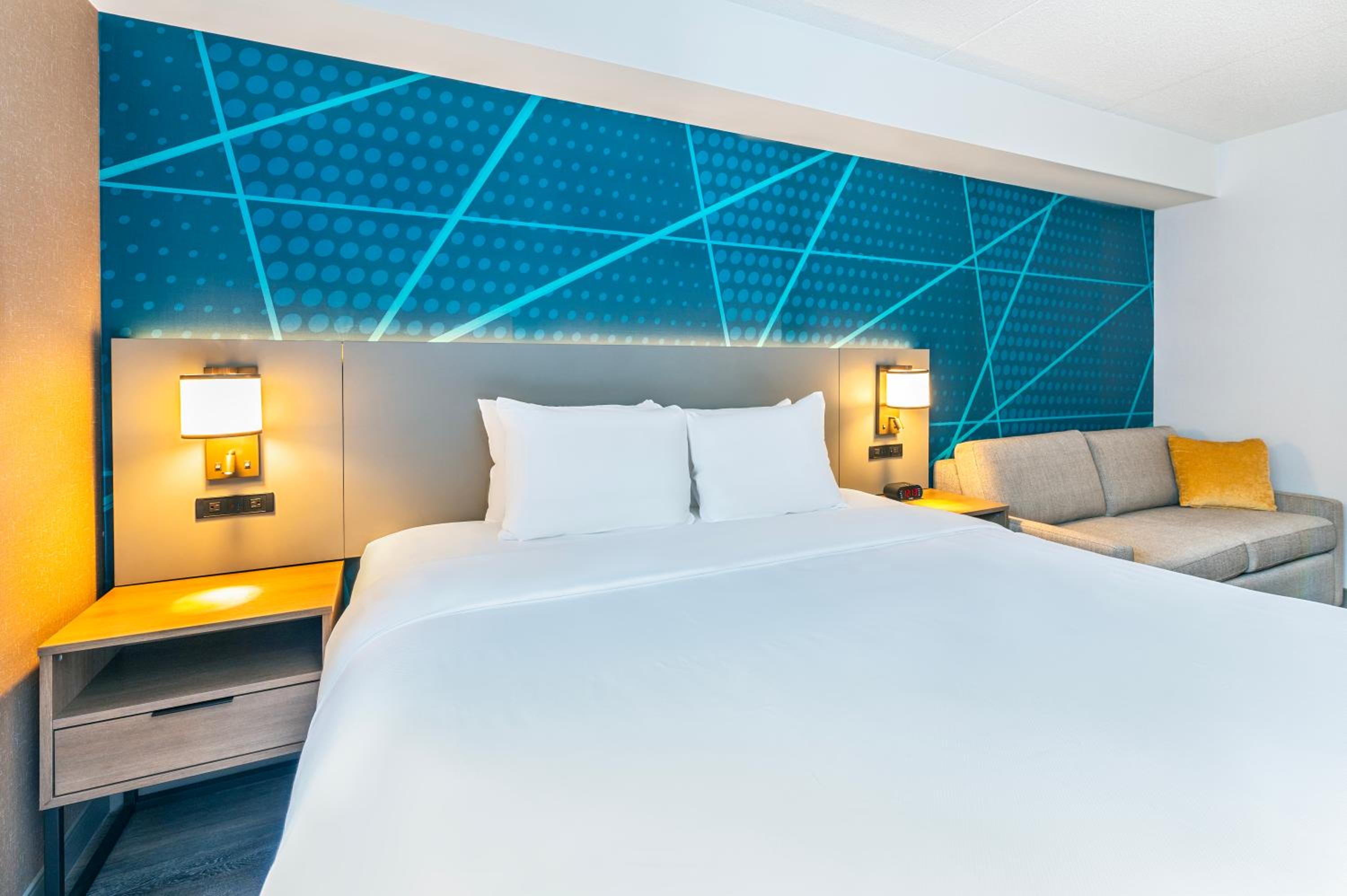 hotel room with a king size bed and a sofa