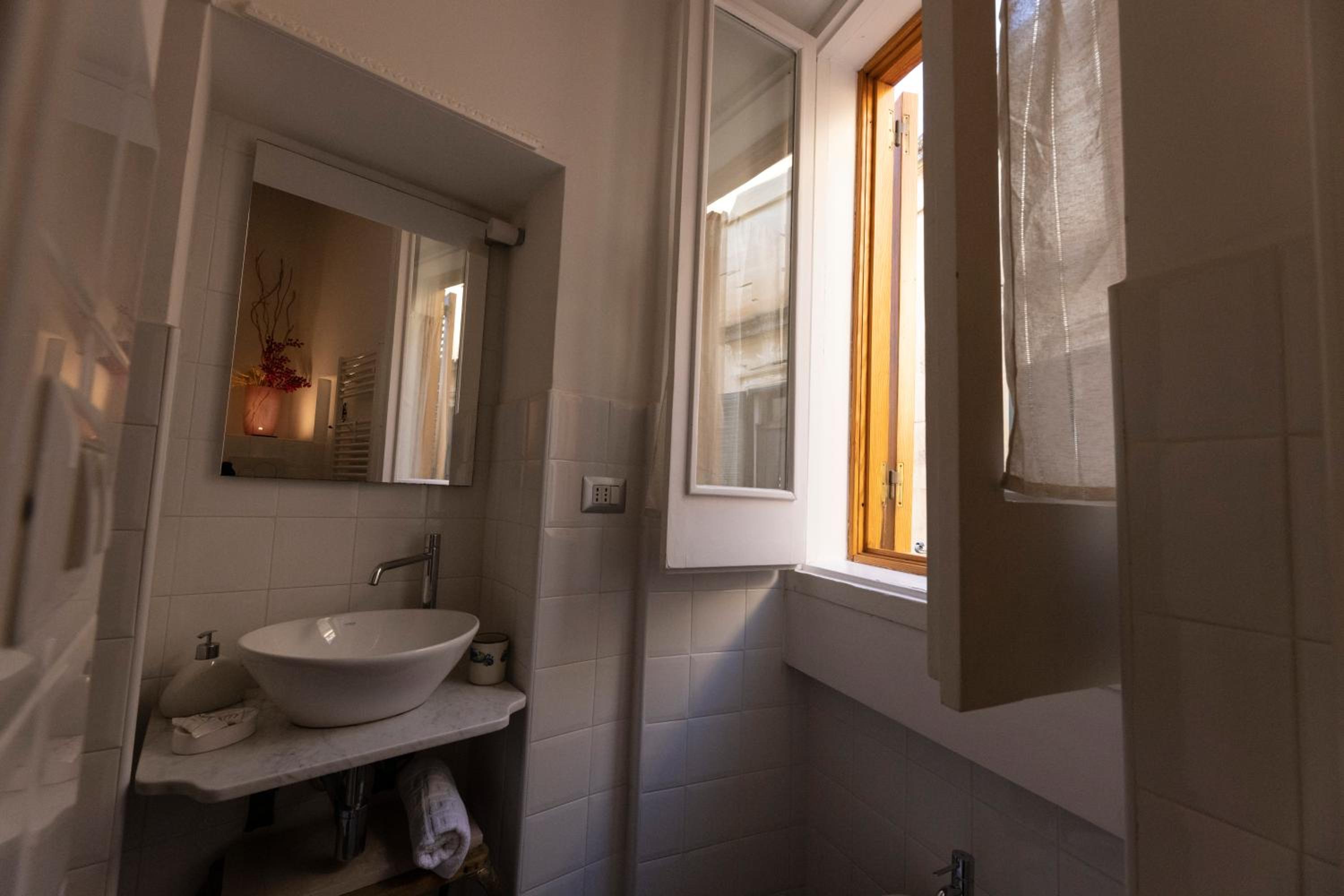 Quadruple Room with Balcony - Photo 24