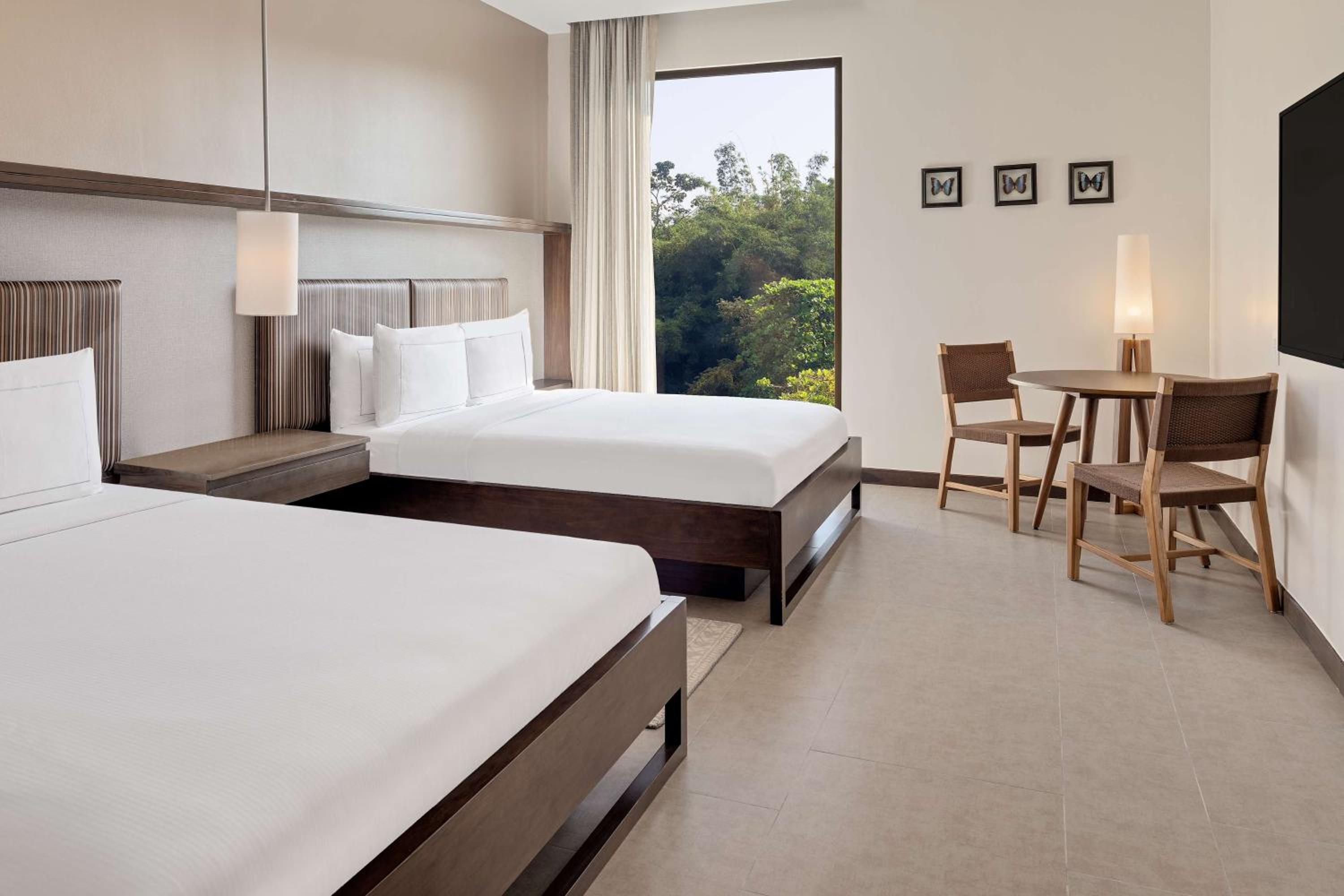 Queen Room with Two Queen Beds and Seating Area - Photo 2