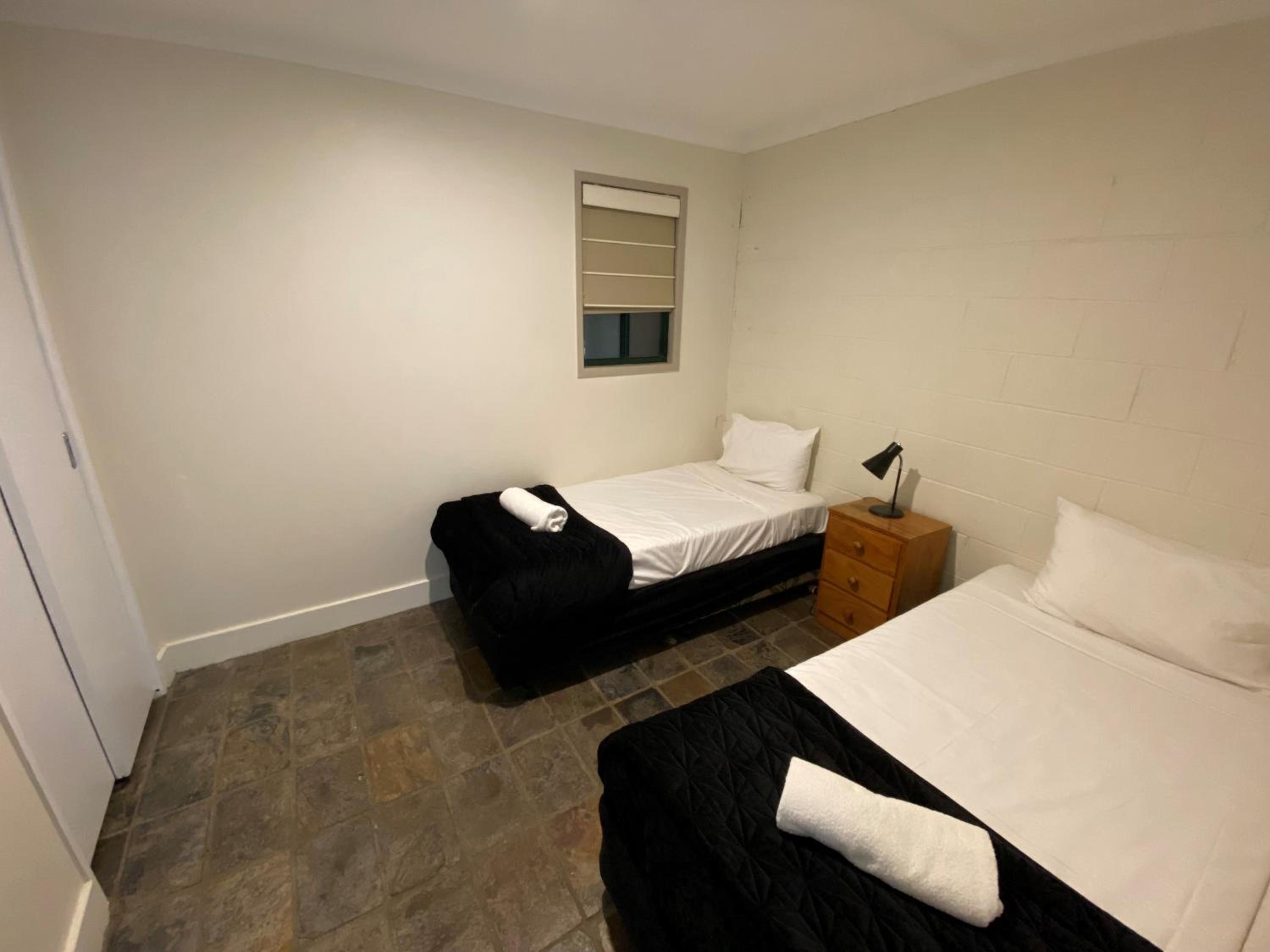 Two-Bedroom Unit with living area and stairs photo 2