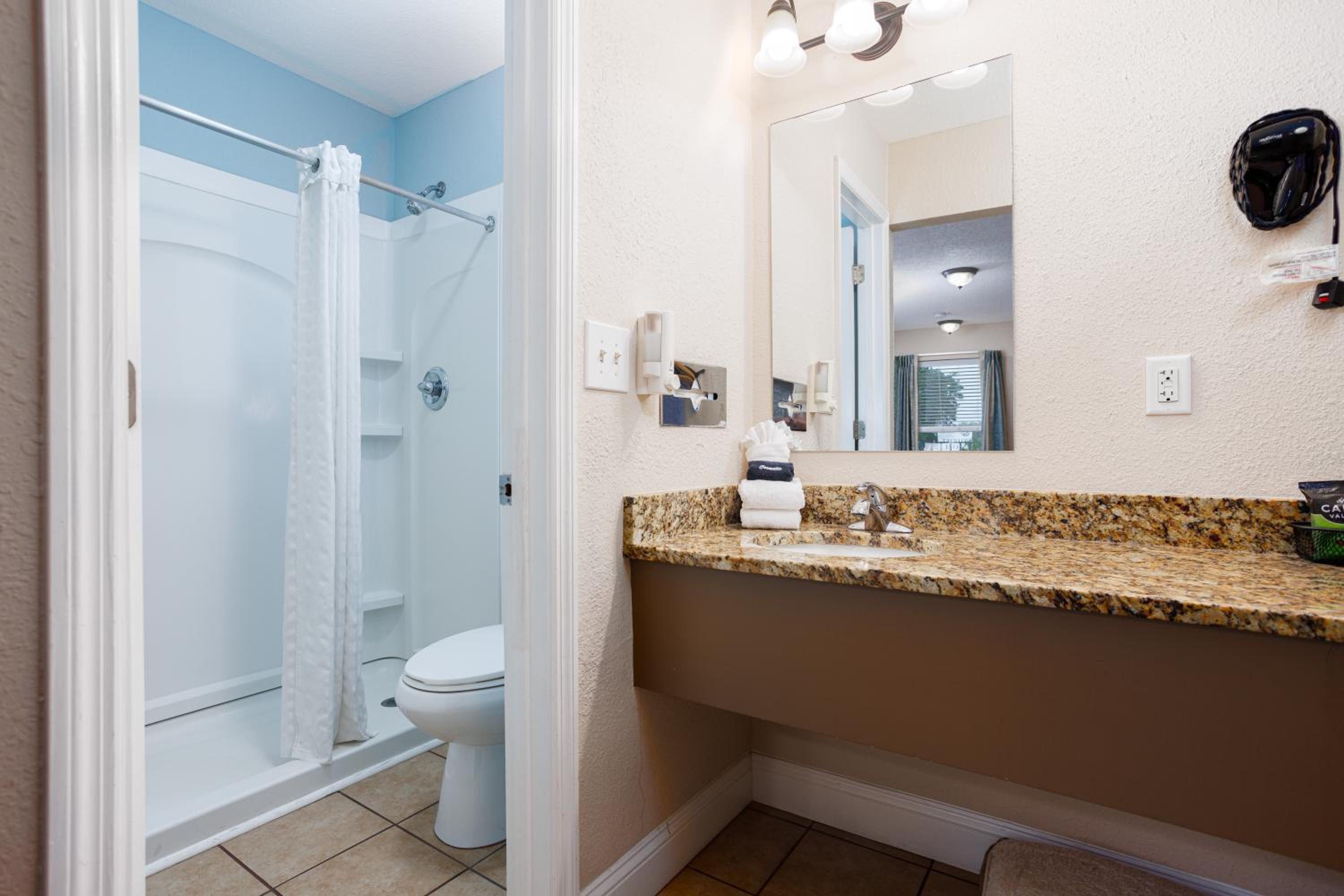 Queen Room With Two Queen Beds - Pet-Friendly photo 2