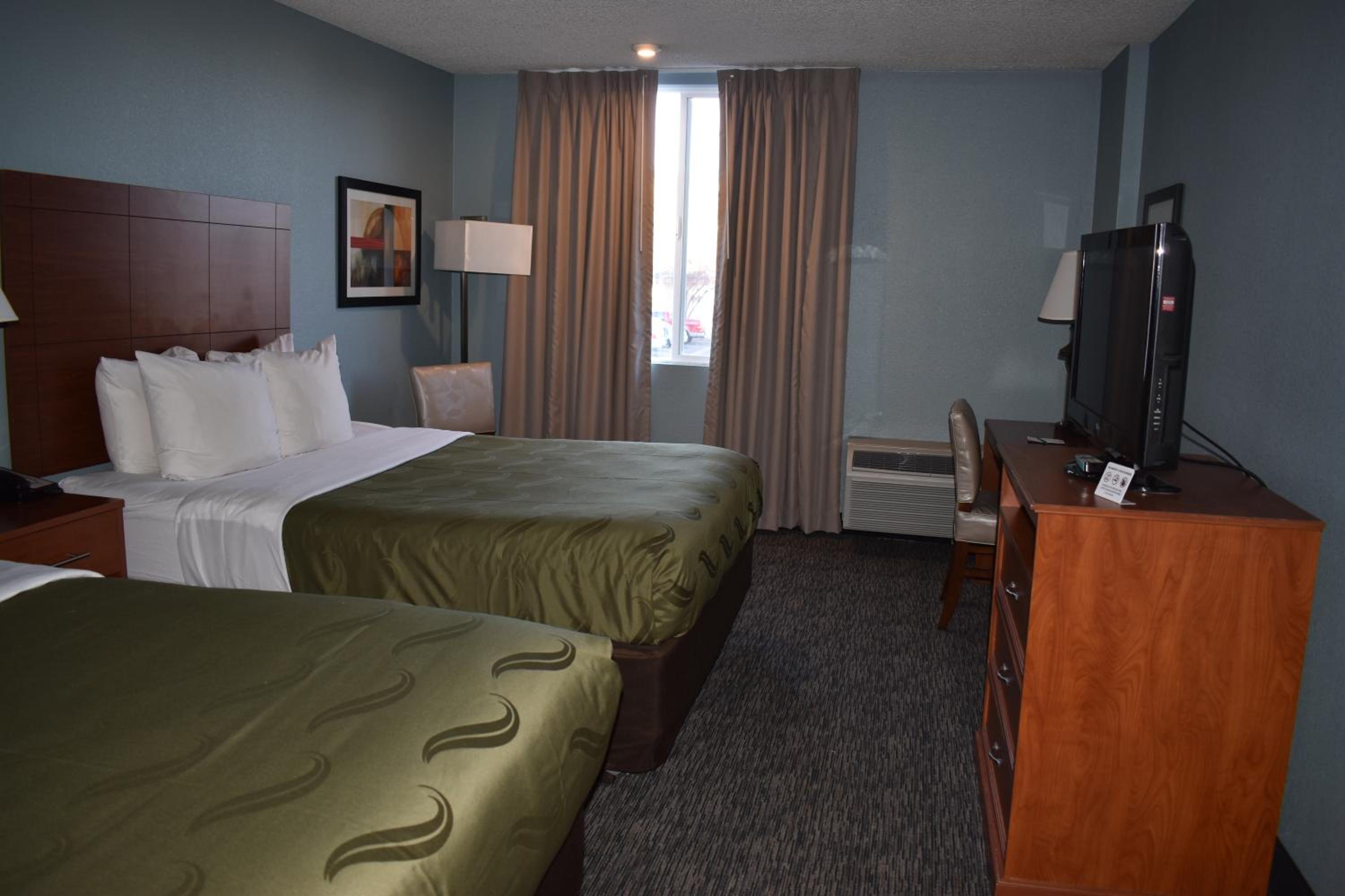 One-Bedroom Queen Suite with Two Queen Beds and Sofa Bed - No Pets - Photo 1